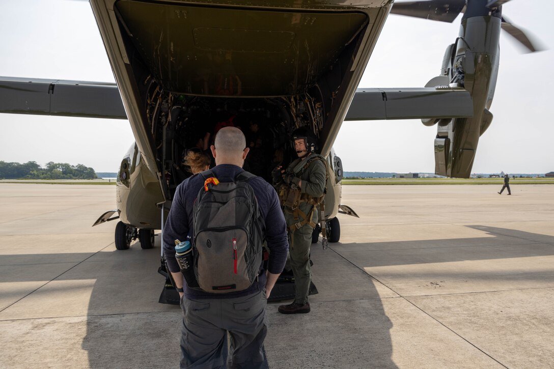 College coaches and educators exit a MV-22B 'Osprey' flown by Marine Helicopter Squadron One pilots while attending the Coaches Workshop hosted by the Marine Corps Recruiting Command at Marine Corps Base Quantico, Va., on May 11, 2023. Upon completion of the workshop, attending coaches and educators will return to their schools and community equipped with a better understanding of the Marine Corps and ability to tell the Marine Corps story. (U.S. Marine Corps photo by Lance Cpl. Gustavo Romero)