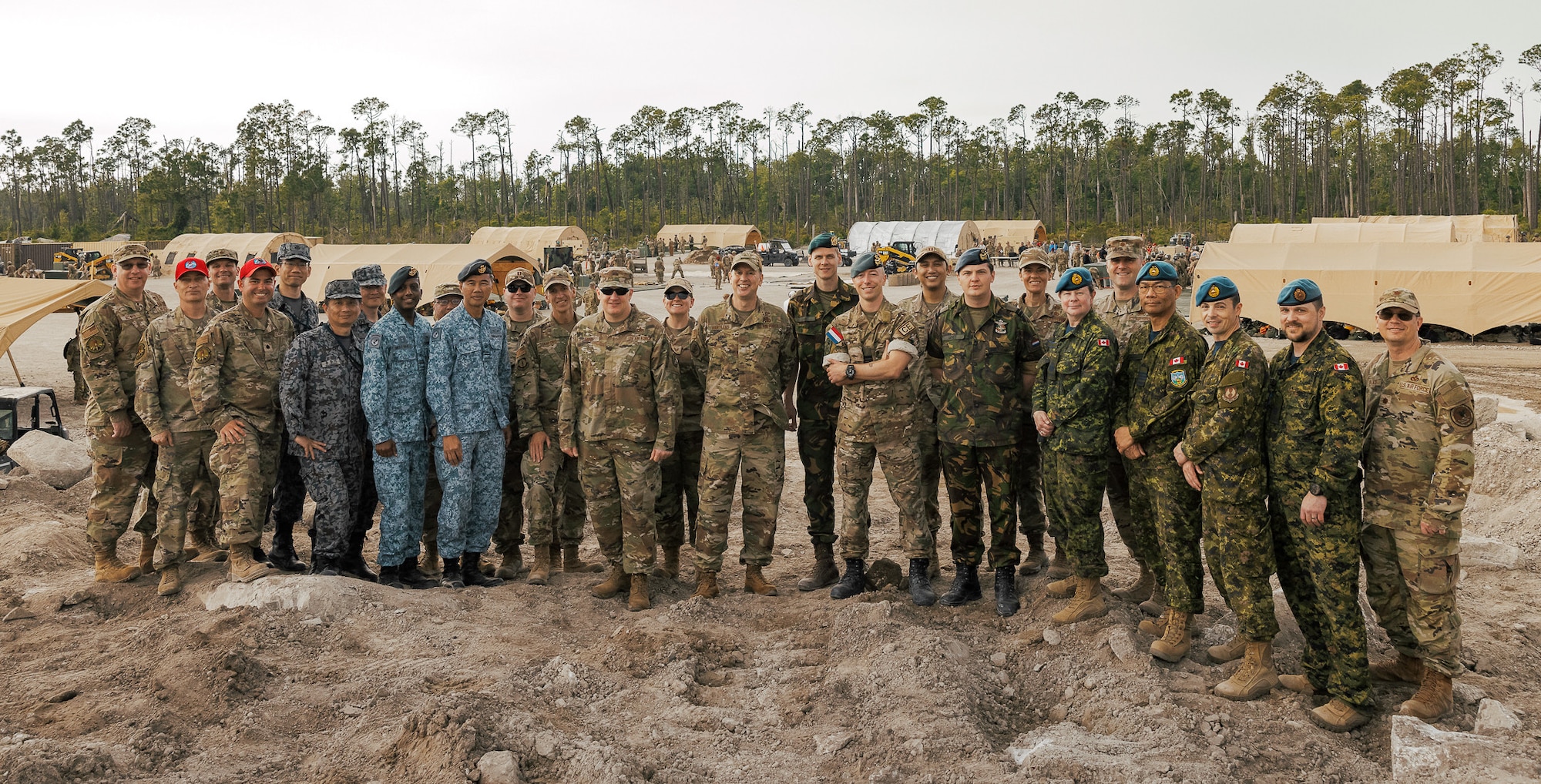 Air Force Civil Engineer leaders including Brig. Gen. William Kale, AFCEC Commander, Brig. Gen. Brian Hartless, Director of Civil Engineers, and Col. Aaron Altwies, Associate Director of Civil Engineers, among others, gather with civil engineer allies and partners representing Canada, Japan, the Netherlands, and Singapore to observe Readiness Challenge IX at Tyndall AFB, Florida April 24-28, 2023. This year’s Readiness Challenge tested civil engineer contingency skills while operating in contested and degraded environments, strengthening their posture for the future fight. It was also an opportunity to promote multilateral cooperation and relationship-building between partner nations in attendance. (U.S. Air Force photo by HAF/A4C Strategic Communications)