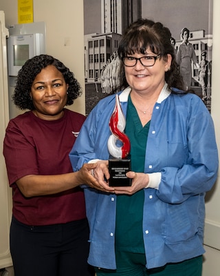 Arrowhead Zone, Bldg. 9a, Emergency Room:
RN Paulette Crull, winner of the Leadership Award

Presented to a manager, service chief, department chief, or enlisted leader who stands out as a role model who demonstrates exceptional leadership, guidance and service to their organization, the profession of nursing, and the staff that they lead. They demonstrate outstanding staff support through unit/department cohesiveness, mentorship and promoting a shared mental model of unit/department goals. This is demonstrated by excellent delivery and outstanding results.

Photograph by Harvey A. Duze (Office of Command Communications – WRNMMC)