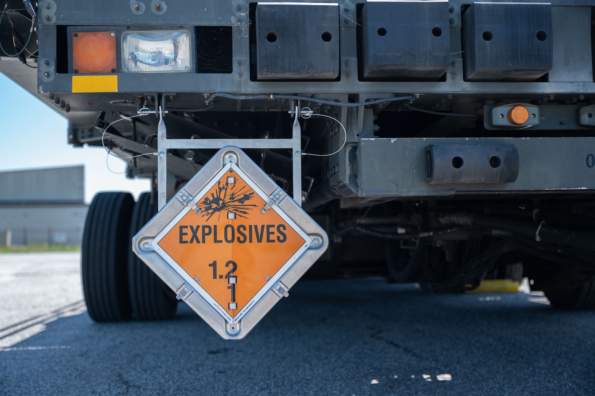 An explosives sign on a K-loader identifies the nature of cargo during a foreign military sales mission between the U.S. and Switzerland at Dover Air Force Base, Delaware, May 14, 2023. The U.S. established diplomatic relations with Switzerland in 1853, following the formation of a unified Swiss state. (U.S. Air Force photo by Senior Airman Cydney Lee)