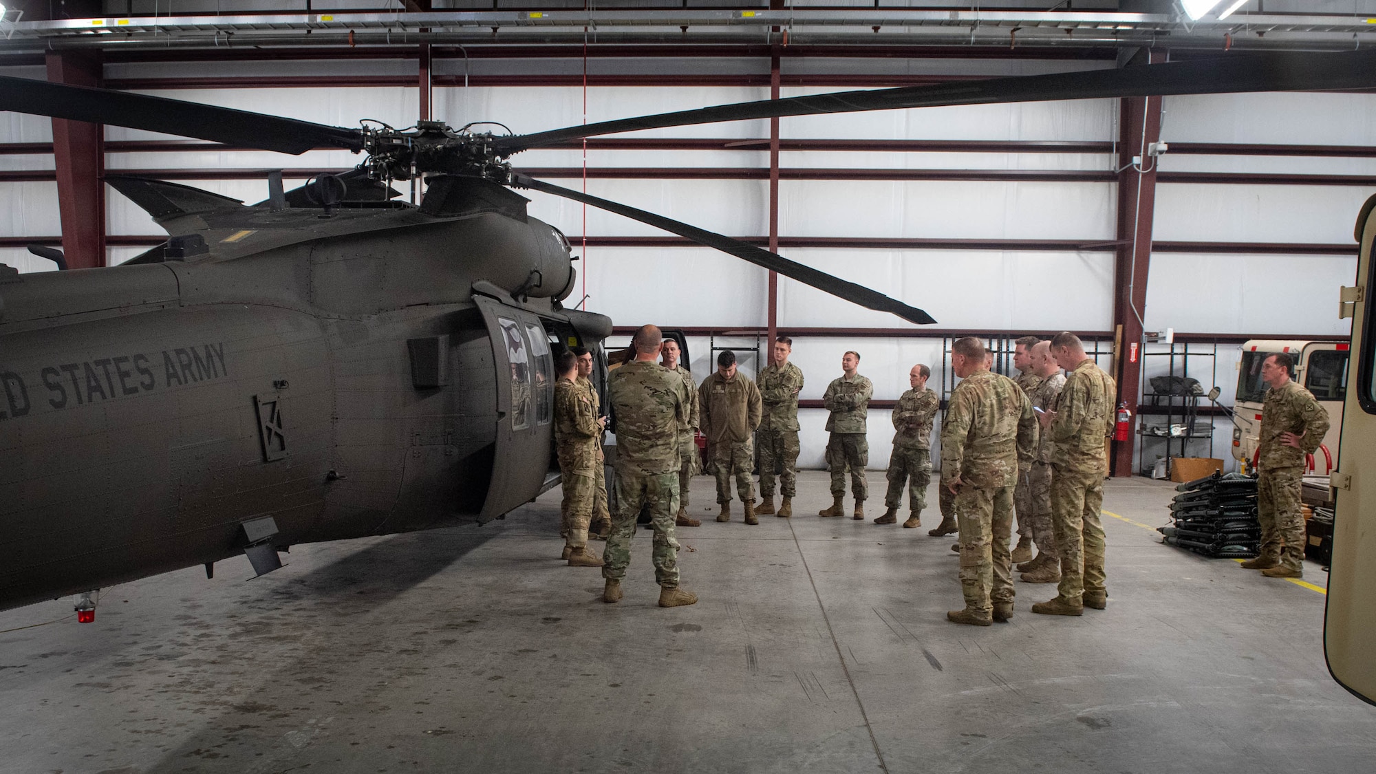 Airmen assigned to the Kentucky Air National Guard's 123rd Contingency Response Group train on hot-refueling techniques and prepare cargo for a helicopter-borne sling load carry at Boone National Guard Center in Frankfort, Ky., March 23, 2023. The training, conducted jointly with the Kentucky Army National Guard’s 63rd Theater Aviation Brigade, enhances the Air Guard unit’s ability to employ UH-60 Black Hawk helicopters in domestic and wartime environments. (U.S. Air National Guard photo by Staff Sgt. Clayton Wear)