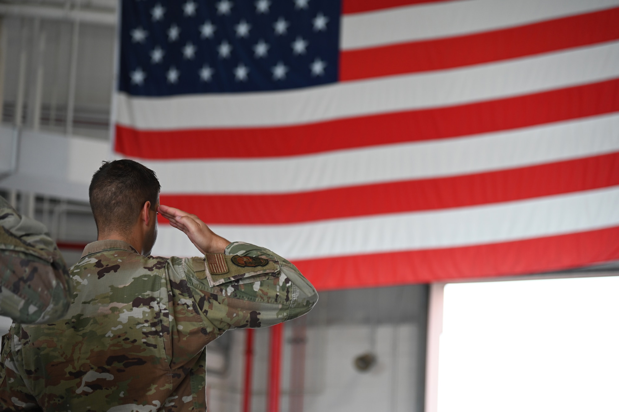 U.S. Air Force Maj. Joseph Carpentieri, commander, Base Defense Squadron, salutes during the 9/11 Day Remembrance Ceremony Sept. 11, 2022 at Stewart Air National Guard Base, Newburgh, New York.