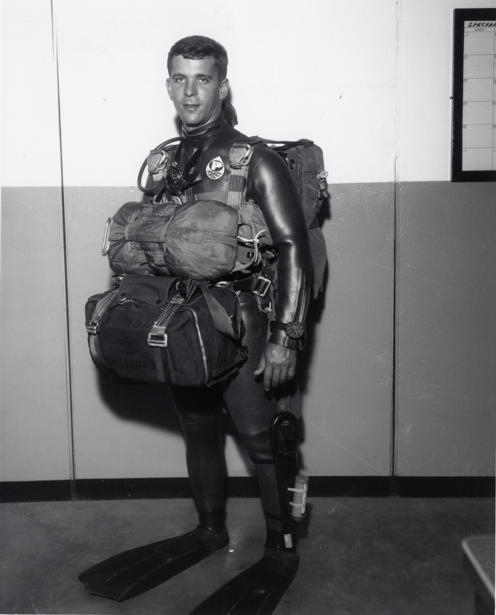 Pararescuemen are trained medical technicians with advanced military skills such as scuba and parachuting. Here, a PJ is shown wearing the standard equipment to perform a water parachute jump in 1970.