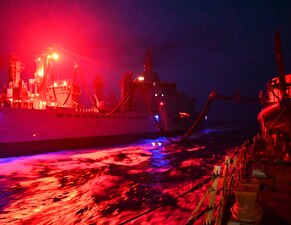 USS James E. Williams (DDG 95), right, conducts a replenishment-at-sea with the Italian navy logistics support ship ITS Vulcano (A5335) in the Ionian Sea.