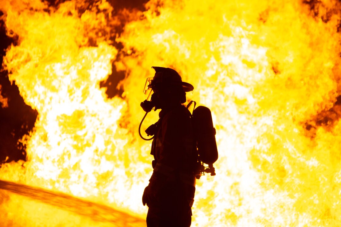 U.S. Marine with Air Crash Fire Rescue participates in a live aircraft fire training exercise at Marine Corps Air Station New River, Jacksonville, North Carolina, May 12, 2023. Marine Corps firefighters conducted live aircraft fire training to build trust, teamwork and the ability to act in emergency situations.