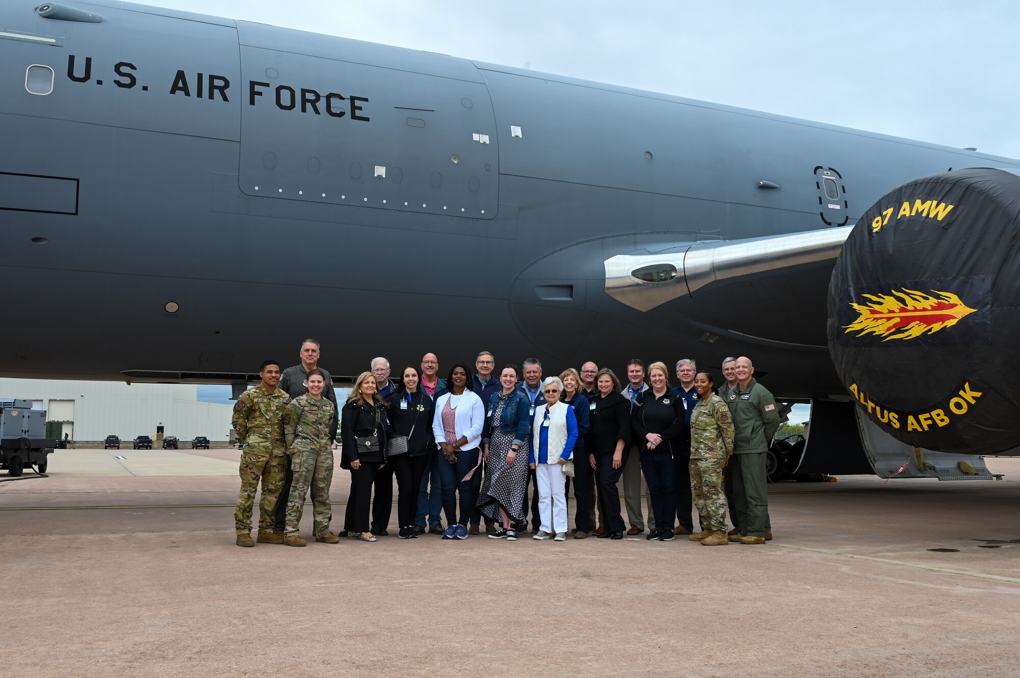 U.S. Air Force Gen. Mike Minihan, AMC commander, Air Mobility Command civic leaders, and 97th Air Mobility Wing leaders and Airmen pose for a group photo in front of a KC-46 Pegasus at Altus Air Force Base, Oklahoma, April 27, 2023. The AMC civic leaders visited the base from multiple AMC bases across the United States. (U.S. Air Force photo by Senior Airman Kayla Christenson)