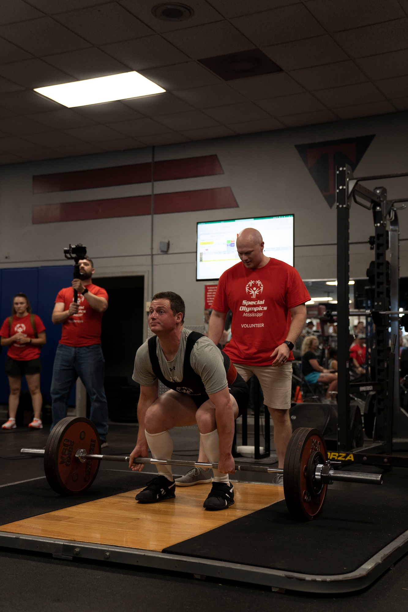 A Special Olympics Mississippi athlete competes in a powerlifting event during the SOMS Summer Games at Keesler Air Force Base, Mississippi, May 13, 2023.