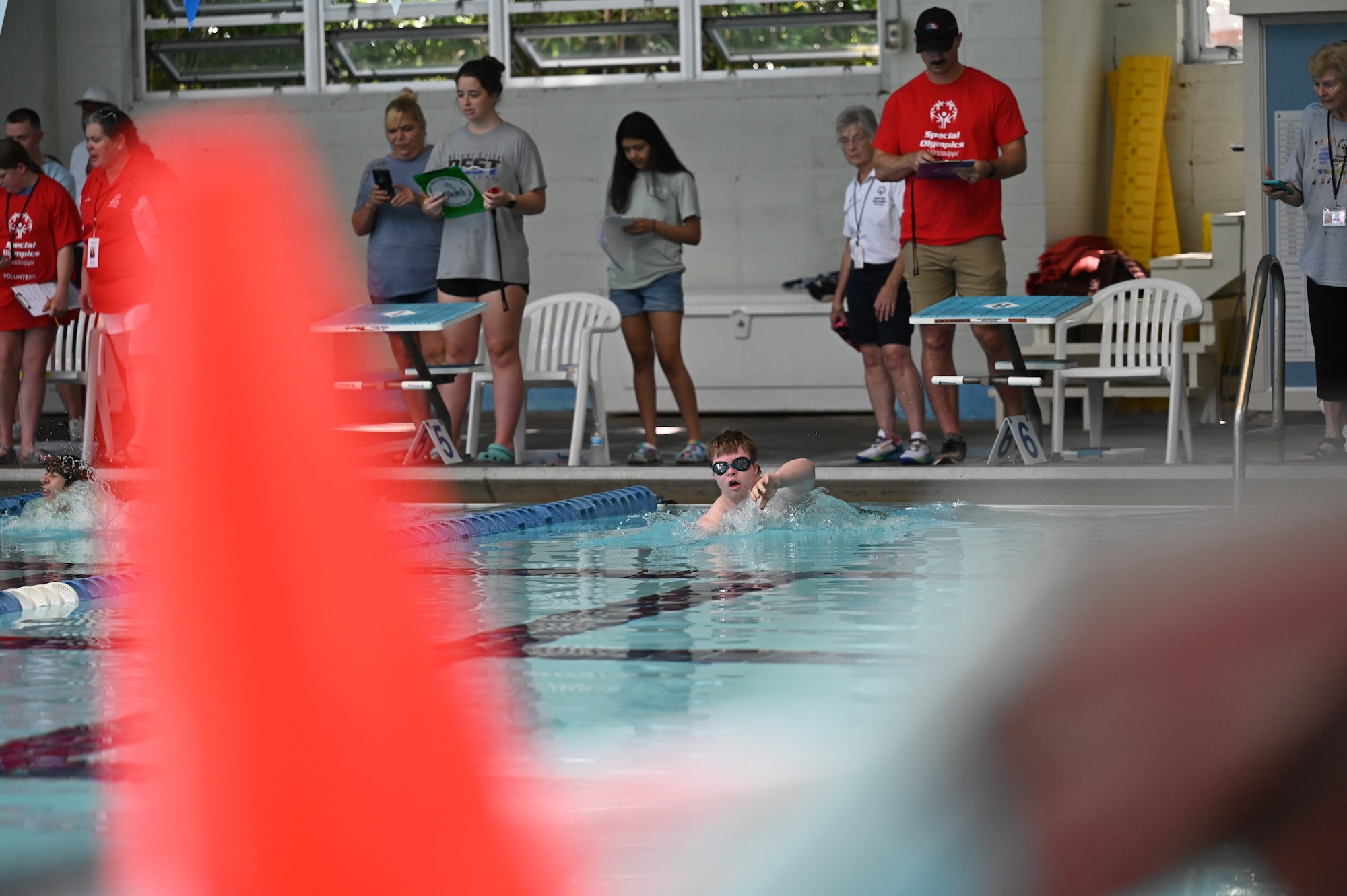 A Special Olympics Mississippi athletes competes in a swimming event during the SOMS Summer Games at Keesler Air Force Base, Mississippi, May 13, 2023.
