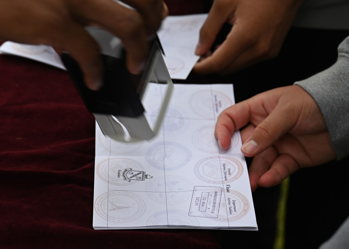 Members attending the Defense Language Institute Foreign Language Center Language Day get their passports stamped, Calif., May 12, 2023. Visitors received passports and traveled to booths representing countries students assigned to the 517th Training Squadron learn about and received a stamp after completing games and trivia. (U.S. Air Force photo by Airman 1st Class Zach Heimbuch)