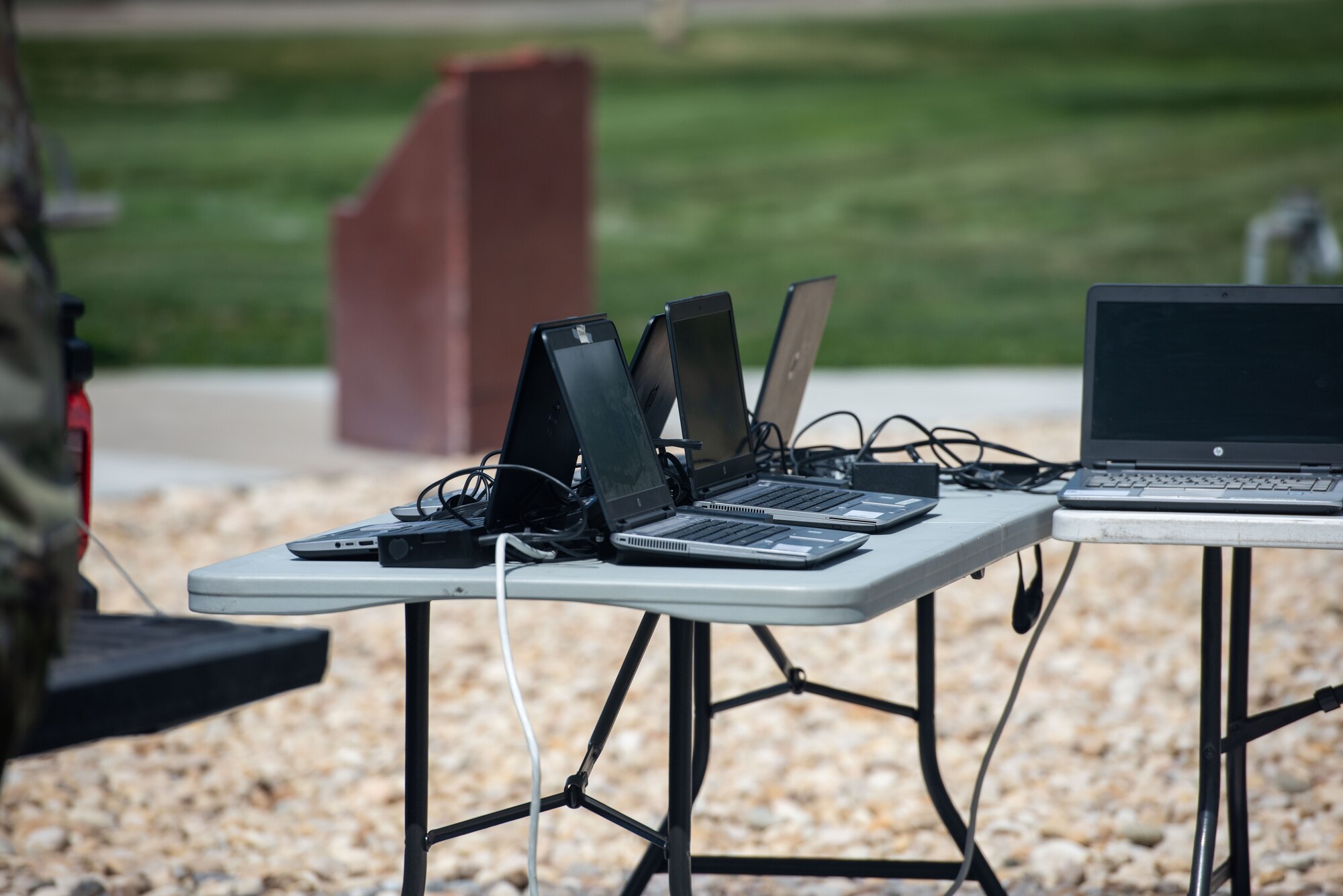 Laptops charging on a table.