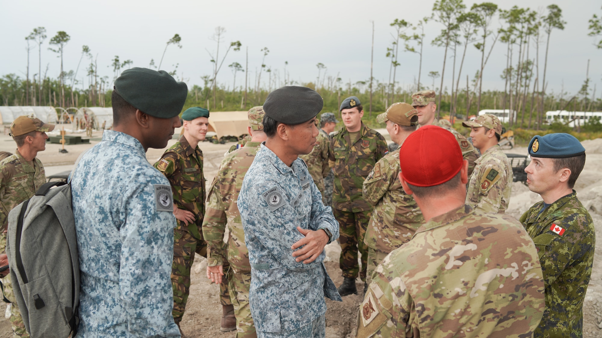 Civil engineers representing Canada, the Netherlands, and Singapore engage in conversation amongst U.S. civil engineers while observing Readiness Challenge IX at Tyndall Air Force Base, Florida April 24-28, 2023. This year’s Readiness Challenge tested civil engineer contingency skills while operating in contested and degraded environments, strengthening their posture for the future fight. It was also an opportunity to promote multilateral cooperation and relationship-building between partner nations in attendance. (U.S. Air Force photo by HAF/A4C Strategic Communications)