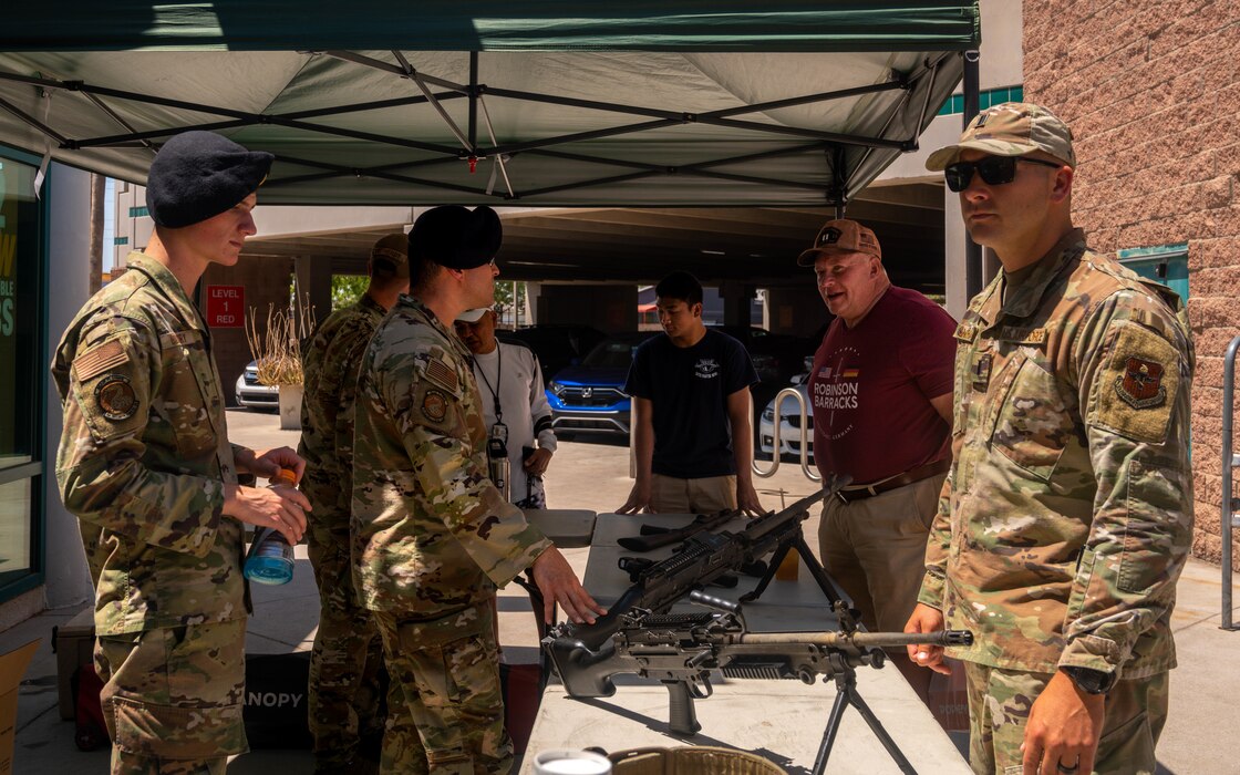 Members of the 56th Security Forces Squadron speak with veterans and their families May 16, 2023, at Luke Air Force Base, Arizona.