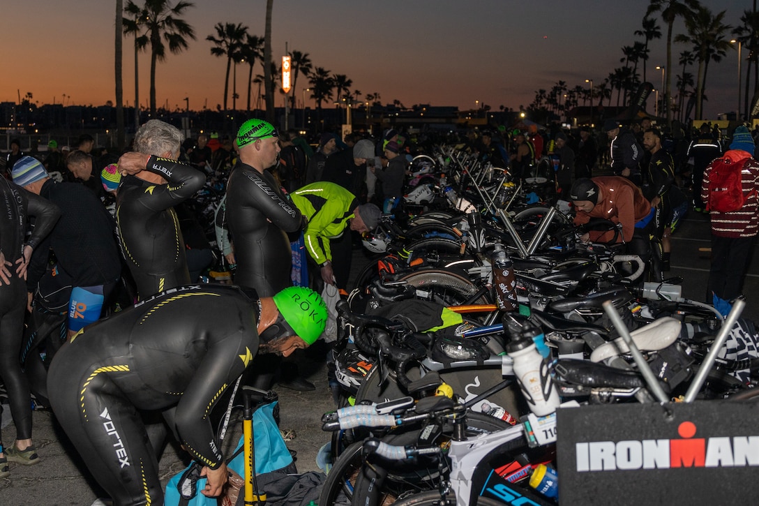 Participants prepare their gear before the Ironman 70.3 Oceanside race at Oceanside Harbor, California, April 1, 2023. The Ironman course consists of a 1.2-mile swim in the Oceanside Harbor, 56-mile bicycle ride through Camp Pendleton and a 13.1-mile run to the Oceanside Pier Amphitheater. (U.S. Marine Corps photo by Lance Cpl. Mhecaela J. Watts)