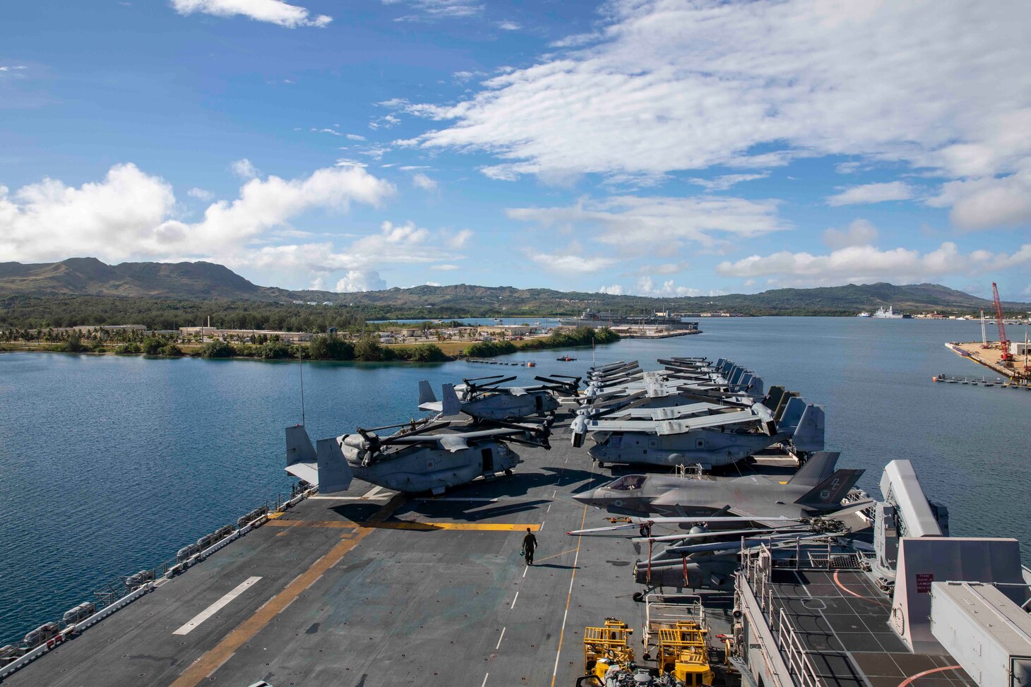 Amphibious assault ship USS Makin Island (LHD 8) enters port in Guam, May 14, 2023. The Makin Island Amphibious Ready Group, comprised of Makin Island and amphibious transport docks USS Anchorage (LPD 23) and USS John P. Murtha (LPD 26), is operating in the U.S. 7th Fleet area of operations with the embarked 13th Marine Expeditionary Unit to enhance interoperability with Allies and partners and serve as a ready-response force to defend peace and maintain stability in the Indo-Pacific region.