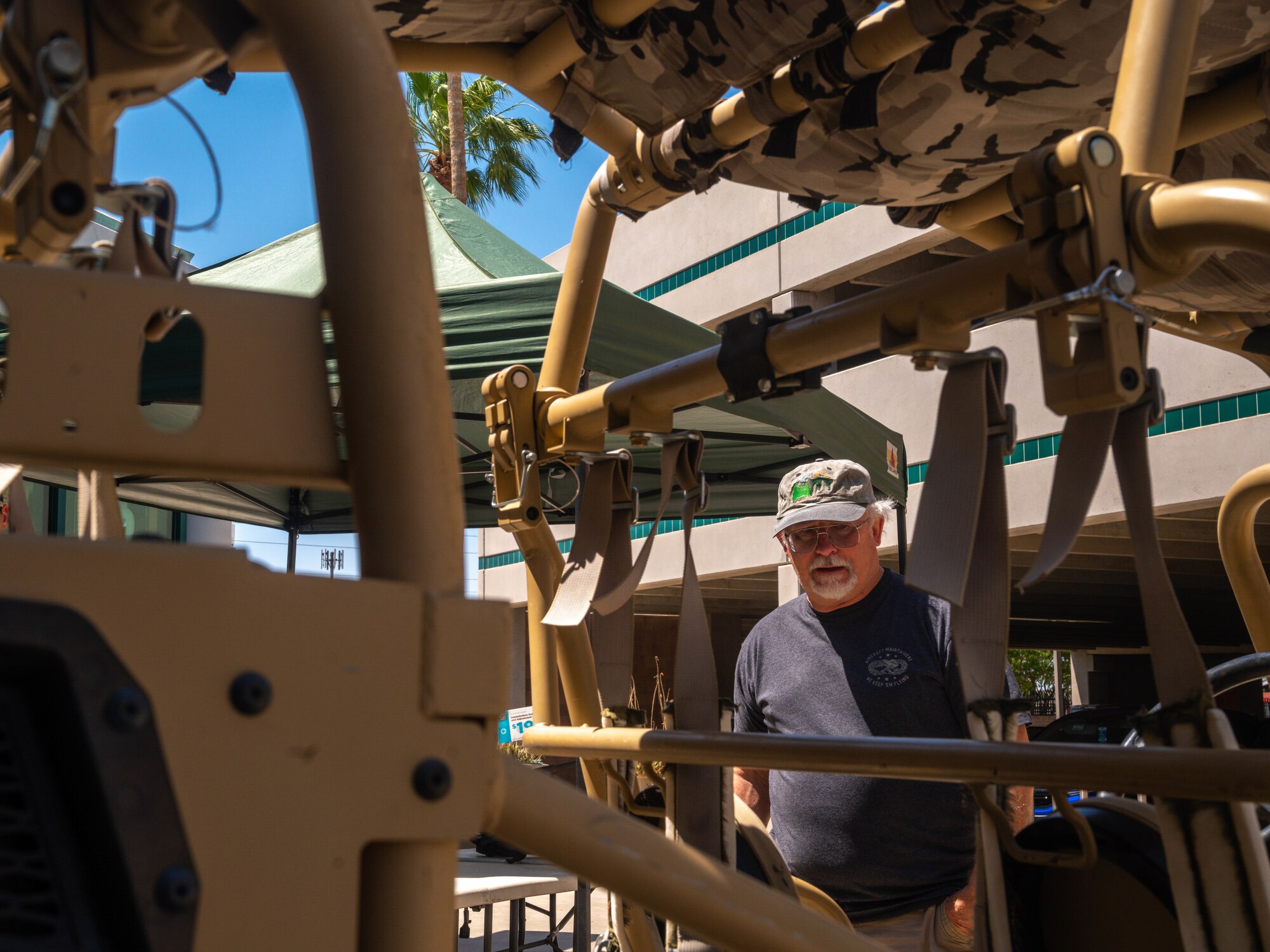A U.S. Air Force veteran looks at a Polaris Raptor assigned to the 56th Security Forces Squadron, May 16, 2023, at Luke Air Force Base, Arizona.