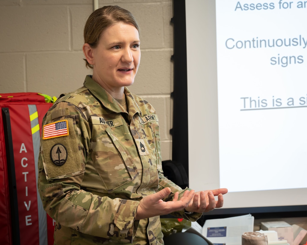 Army Sgt. 1st Class Megan Authier, Course Manager Training and Readiness Noncommissioned Officer, is shown teaching the classroom portion of a Tactical Combat Casualty Care course at Bradley Air National Guard Base, East Granby, Connecticut, March 8, 2023. TCCC is the fundamentals of life- saving techniques developed for service members to provide trauma care in all situations. (U.S. Air National Guard photo by Master Sgt. Tamara Dabney)