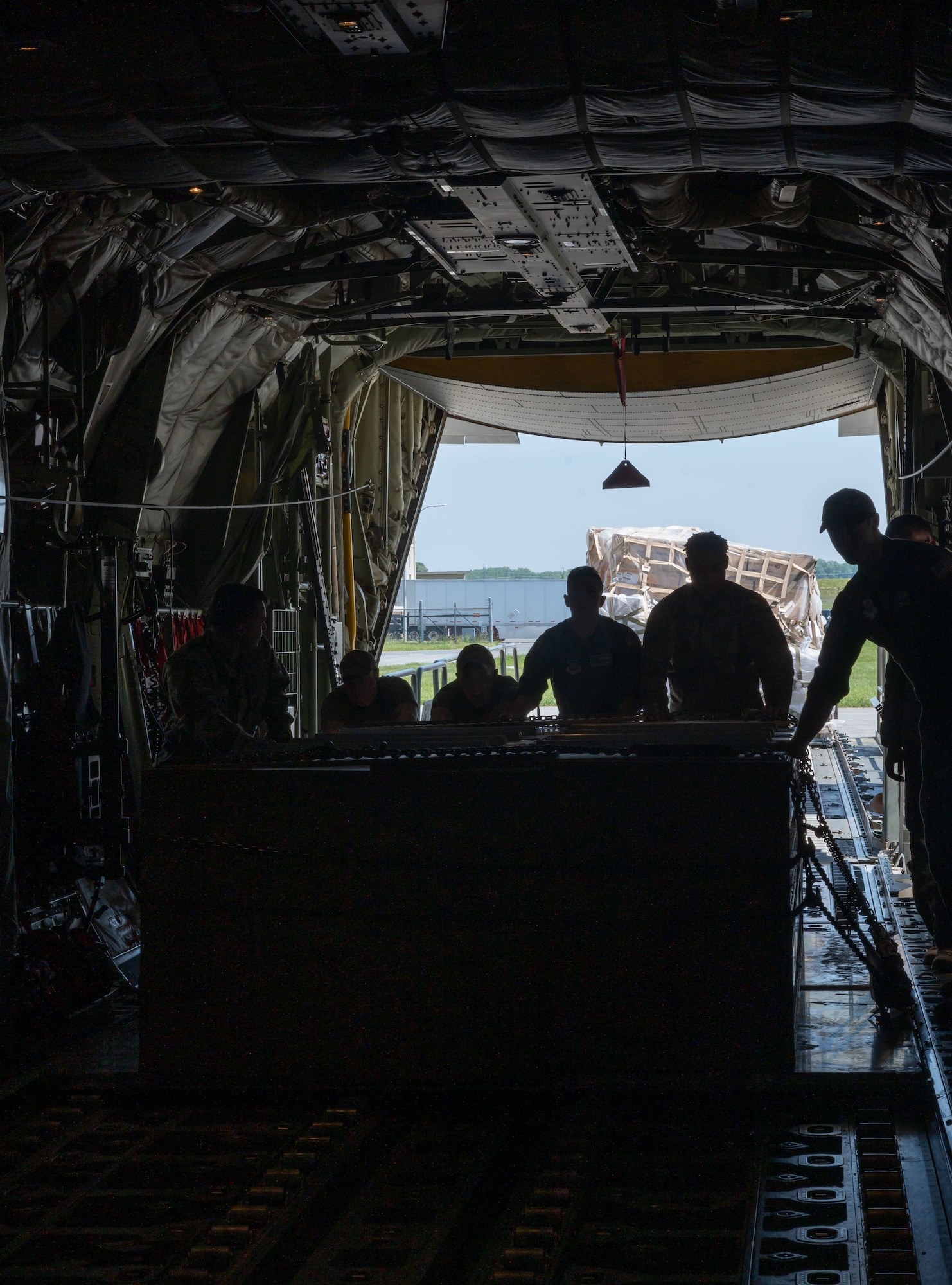 Airmen load cargo onto a C-130J Super Hercules, assigned to the 19th Airlift Wing at Little Rock Air Force Base, Arkansas, during a foreign military sales mission between the U.S. and Switzerland at Dover AFB, Delaware, May 14, 2023. The U.S. established diplomatic relations with Switzerland in 1853, following the formation of a unified Swiss state. (U.S. Air Force photo by Senior Airman Cydney Lee)