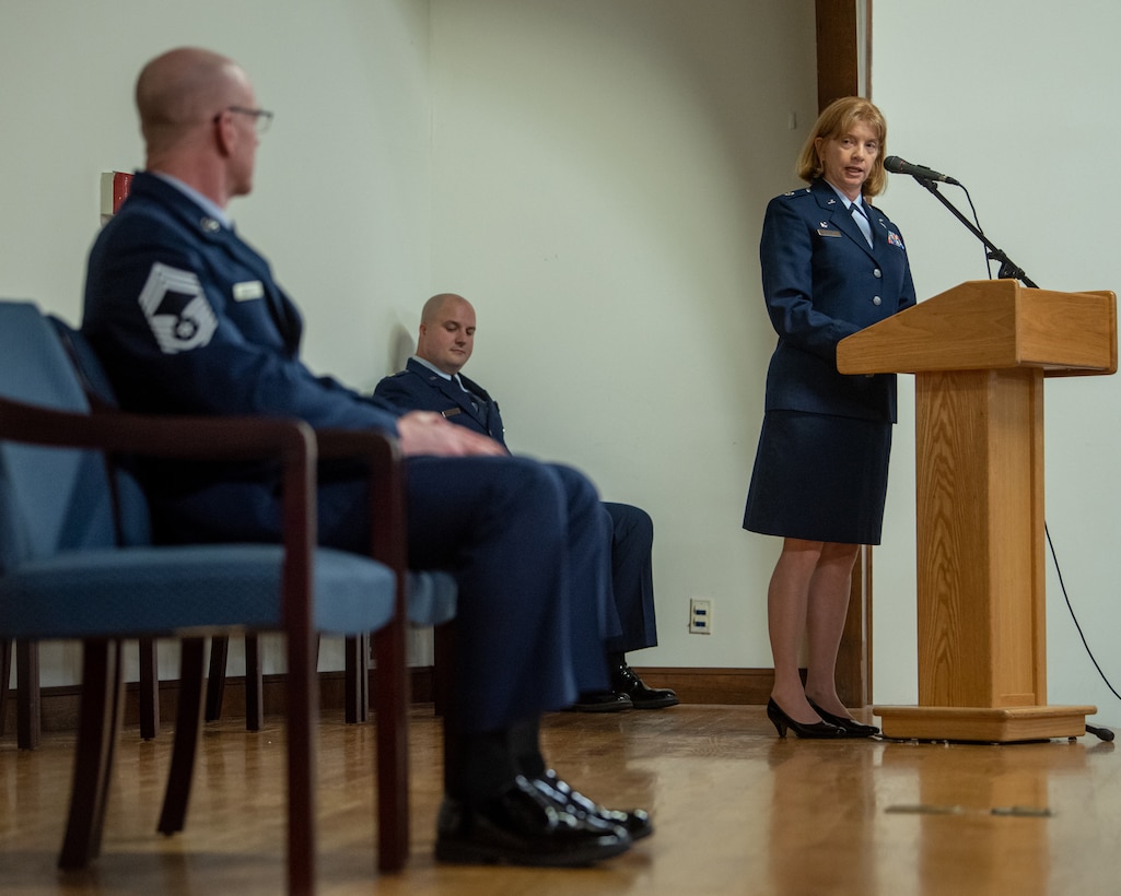 Lt. Col. Leslie Brooks, right, 123rd Logistics Readiness Squadron commander, speaks at the retirement ceremony for Chief Master Sgt. Scott Andrews, left, material management chief enlisted manager for the 123rd LRS, at the Kentucky Air National Guard Base in Louisville, Ky., April 29, 2023. Andrews is retiring after 35 years of military service. (U.S. Air National Guard photo by Tech. Sgt. Joshua Horton)