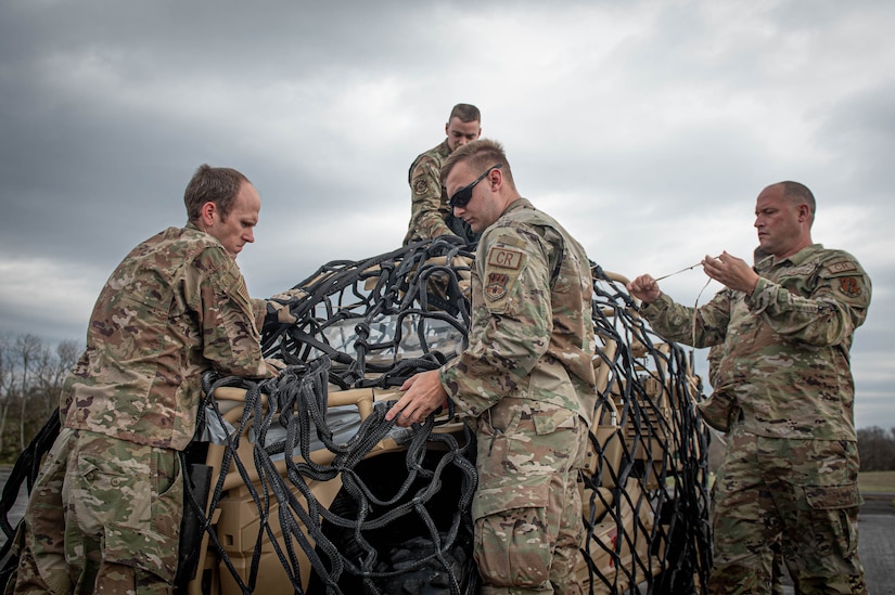 Airmen assigned to the Kentucky Air National Guard's 123rd Contingency Response Group train on hot-refueling techniques and prepare cargo for a helicopter-borne sling load carry at Boone National Guard Center in Frankfort, Ky., March 23, 2023. The training, conducted jointly with the Kentucky Army National Guard’s 63rd Theater Aviation Brigade, enhances the Air Guard unit’s ability to employ UH-60 Black Hawk helicopters in domestic and wartime environments. (U.S. Air National Guard photo by Staff Sgt. Clayton Wear)