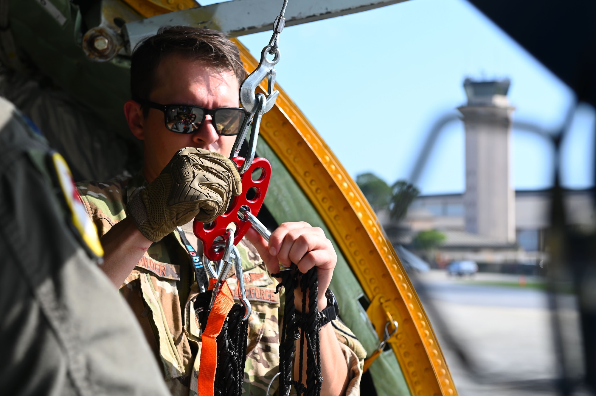 U.S. Air Force Tech. Sgt. Nicholas Sowder, 509th Weapons Squadron Advanced Instructor Training cadre and inflight refueling specialist, prepares to unload cargo using the Pack and Transport Reloader (PATR) crane prototype at Hurlburt Field, Florida, May 6, 2023. Airmen from the 509th WPS tested a new prototype PATR crane during an integration training at a special operations forces exercise at Hurlburt Field. (U.S. Air Force photo by Staff Sgt. Lawrence Sena)