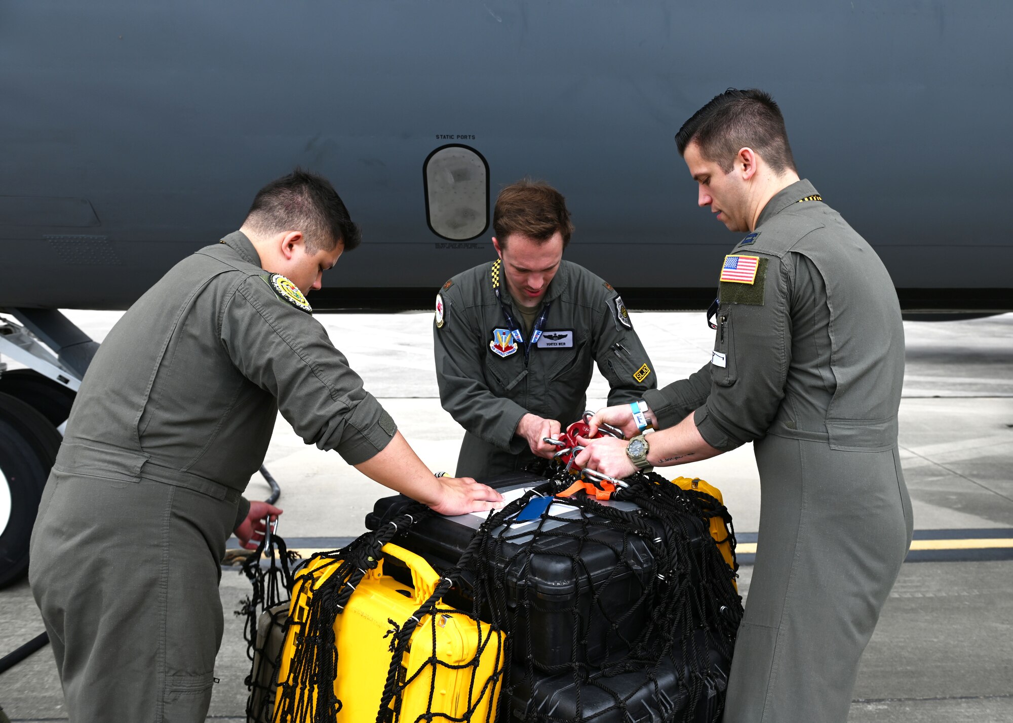 U.S. Air Force Airmen from the 509th Weapons Squadron load cargo prepare to load cargo using the Pack and Transport Reloader (PATR) crane prototype at Hurlburt Field, Florida, May 12, 2023. Initial testing for the crane took place at Fairchild AFB in April, and included the crane lifting multiple litters, a 250-pound Versatile Integrating Partner equipment Refueling (VIPER) refueling kit, and 300 pounds of aircraft equipment to include a tow bar. (U.S. Air Force photo by Staff Sgt. Lawrence Sena)