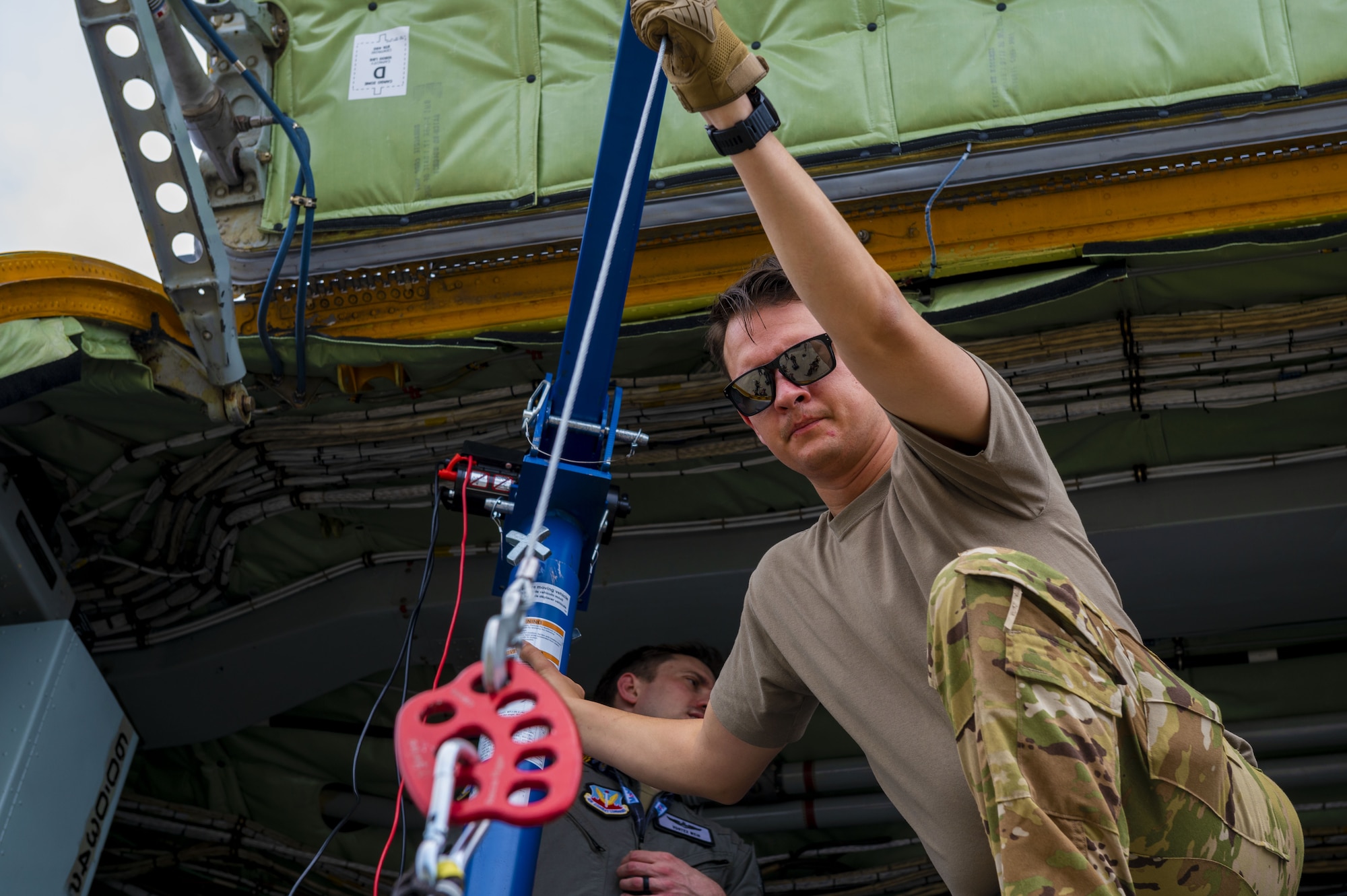 U.S. Air Force Tech. Sgt. Nicholas Sowder, 509th Weapons Squadron Advanced Instructor Training cadre and inflight refueling specialist, operates the Pack and Transport Reloader (PATR) crane prototype at Hurlburt Field, Florida, May 12, 2023. The 509th WPS partnered with Fairchild Air Force Base’s innovation cell to create the crane with a goal of expanding the KC-135 Stratotanker’s ability to load and unload various types of cargo using the PATR crane prototype. (U.S. Air Force photo by Staff Sgt. Lawrence Sena)