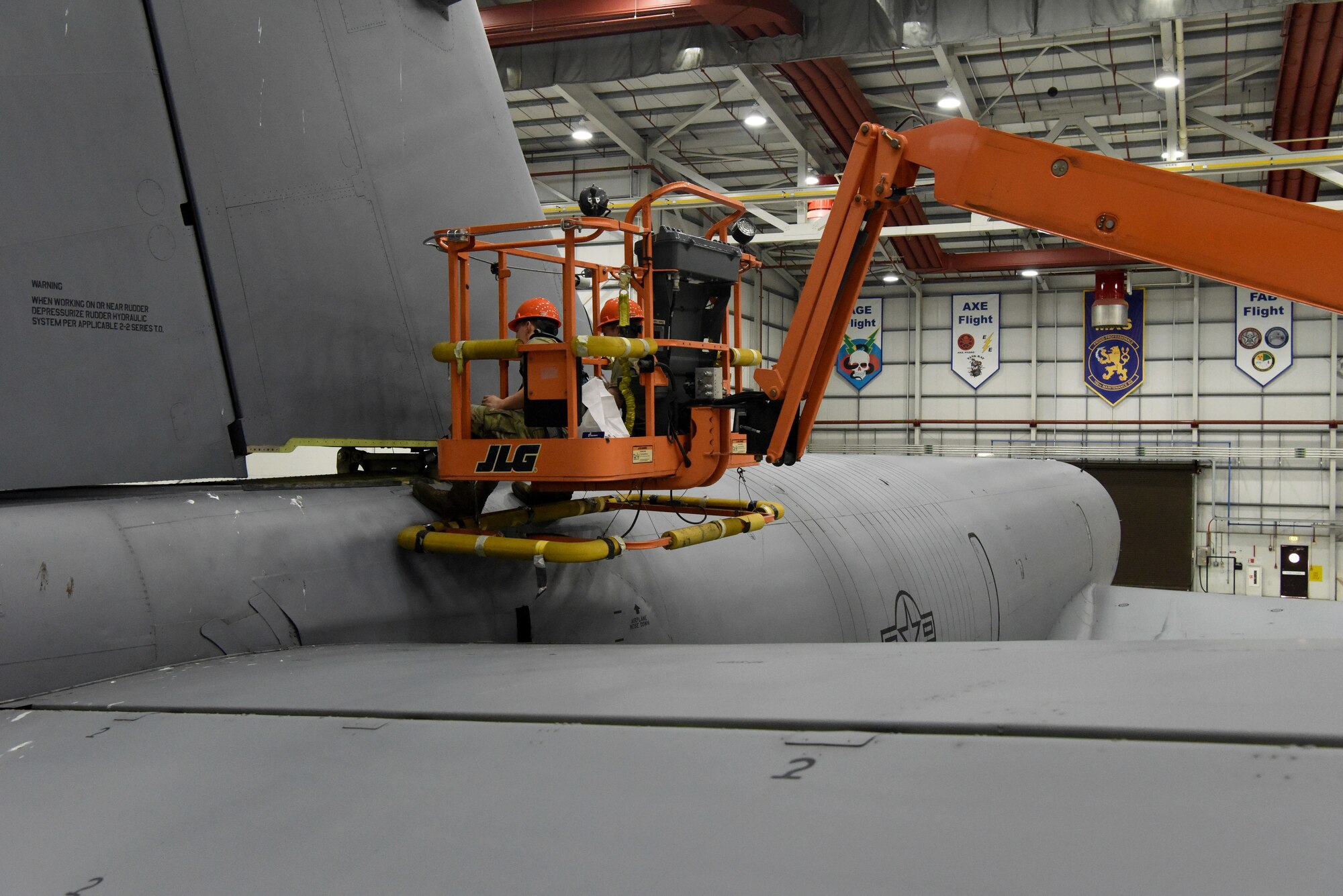 U.S. Air Force Staff Sgt. Spencer Wendrick, left, 100th Maintenance Squadron Repair and Reclamation aero repair craftsman, and U.S. Air Force Airman 1st Class Wyatt Stephenson, 100th MXS Repair and Reclamation journeyman, remove and replace a vertical stabilizer pin on the tail of a KC-135 Stratotanker at Royal Air Force Mildenhall, England, Feb. 24, 2023. Some bases within the States have seen flight restrictions as part of a Time Compliance Technical Order inspection detailing the requirement for vertical stabilizer pins to be replaced due to non-conformity. After a detailed inspection at RAF Mildenhall, it was discovered that some of the jets here carried the affected pins, so as a preventive measure, the 100th Maintenance Squadron immediately began switching them out with a recommended replacement. (U.S. Air Force photo by Karen Abeyasekere)