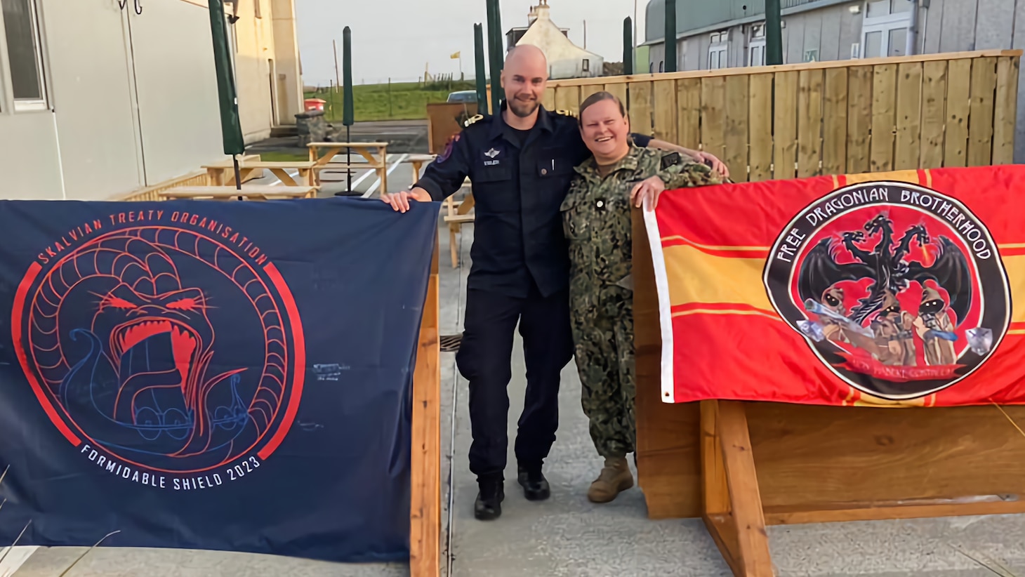 Royal Norwegian Navy Lt. Cmdr. Steinar Valen, the Formidable Shield (FS) mission director in Andøya, Norway, and U.S. Navy Lt. Cmdr. Alisha Hamilton, the overall FS mission director, pose for a photo during FS 2023 in Hebrides, Scotland.
