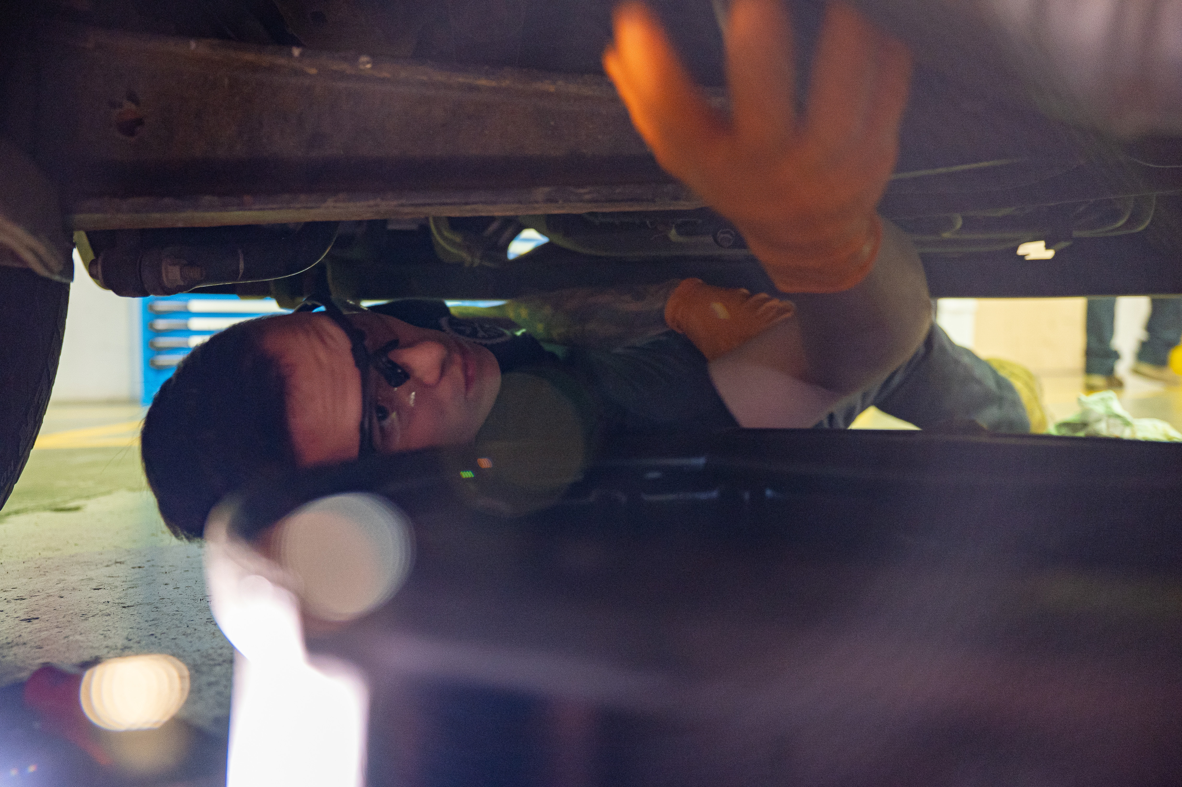 Airman changes oil in truck