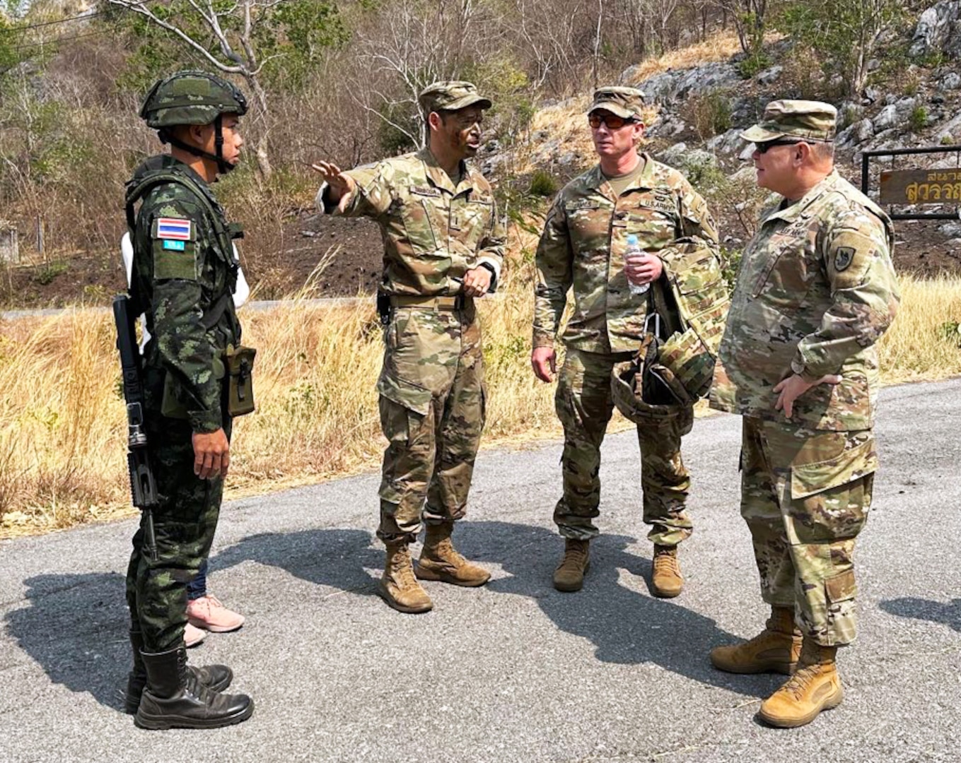 Maj. Gen. Bret Daugherty, the adjutant general, Washington National Guard, and Col. Matthew James, commander, 81st Stryker Brigade Combat Team, receive a briefing while visiting Washington National Guard members working with the Royal Thai Army, March 7, 2023.