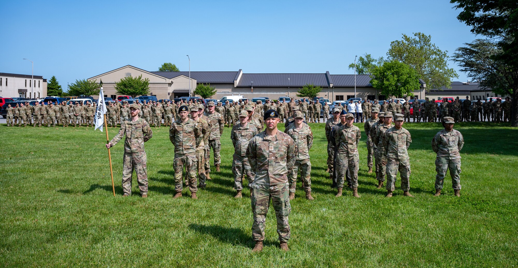 Airman Leadership School Class 23-E and 436th Mission Support Group members stand at parade rest before a retreat ceremony at Dover Air Force Base, Delaware, May 15, 2023. ALS Class 23-E and the 436th MSG hosted the retreat in honor of Peace Officer Memorial Day. (U.S. Air Force photo by Airman 1st Class Amanda Jett)