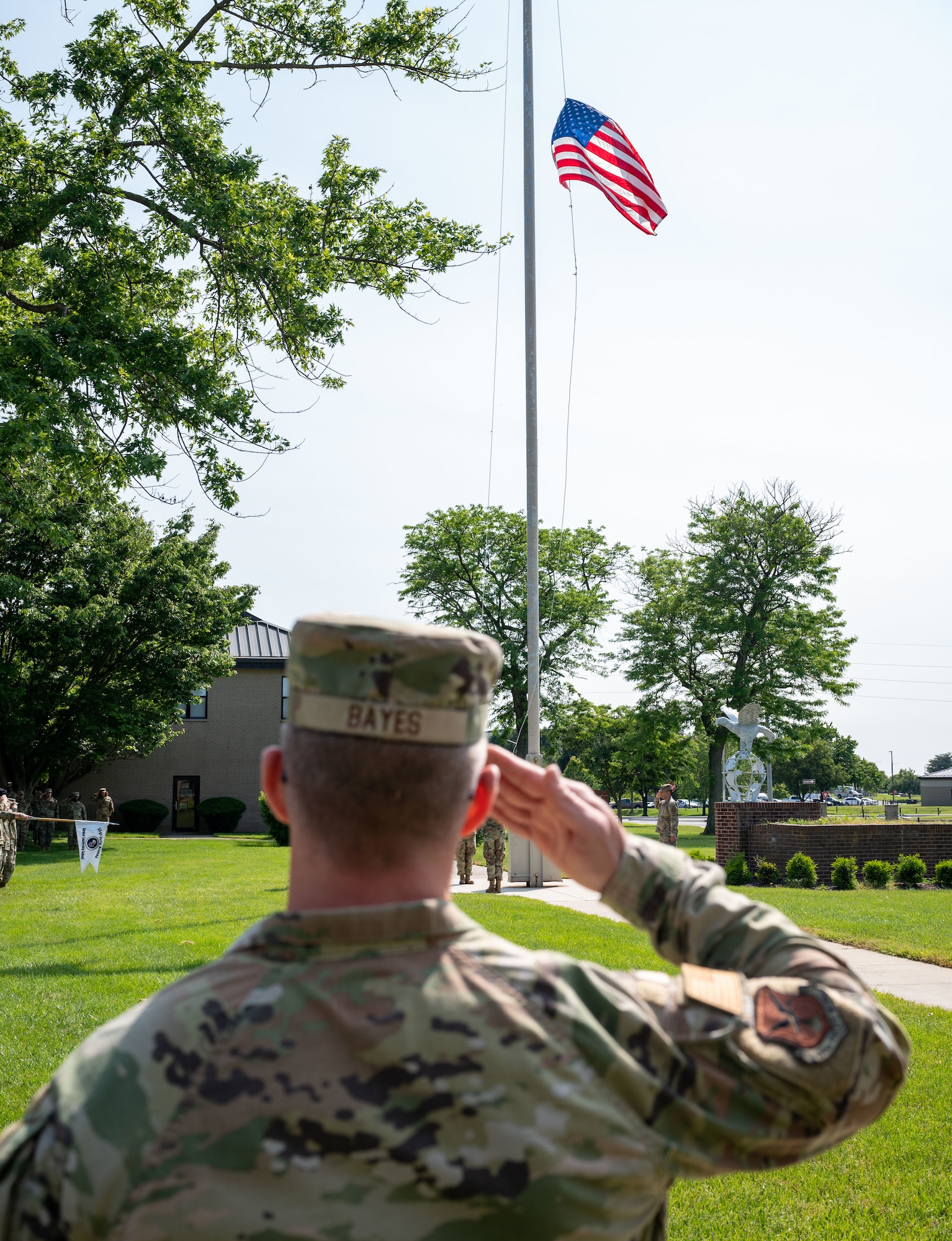 Chief Master Sgt. Timothy Bayes, 436th Airlift Wing command chief, salutes the American flag during a retreat ceremony at Dover Air Force Base, Delaware, May 15, 2023. Airman Leadership School Class 23-E and the 436th Mission Support Group hosted the retreat in honor of Peace Officer Memorial Day. (U.S. Air Force photo by Airman 1st Class Amanda Jett)