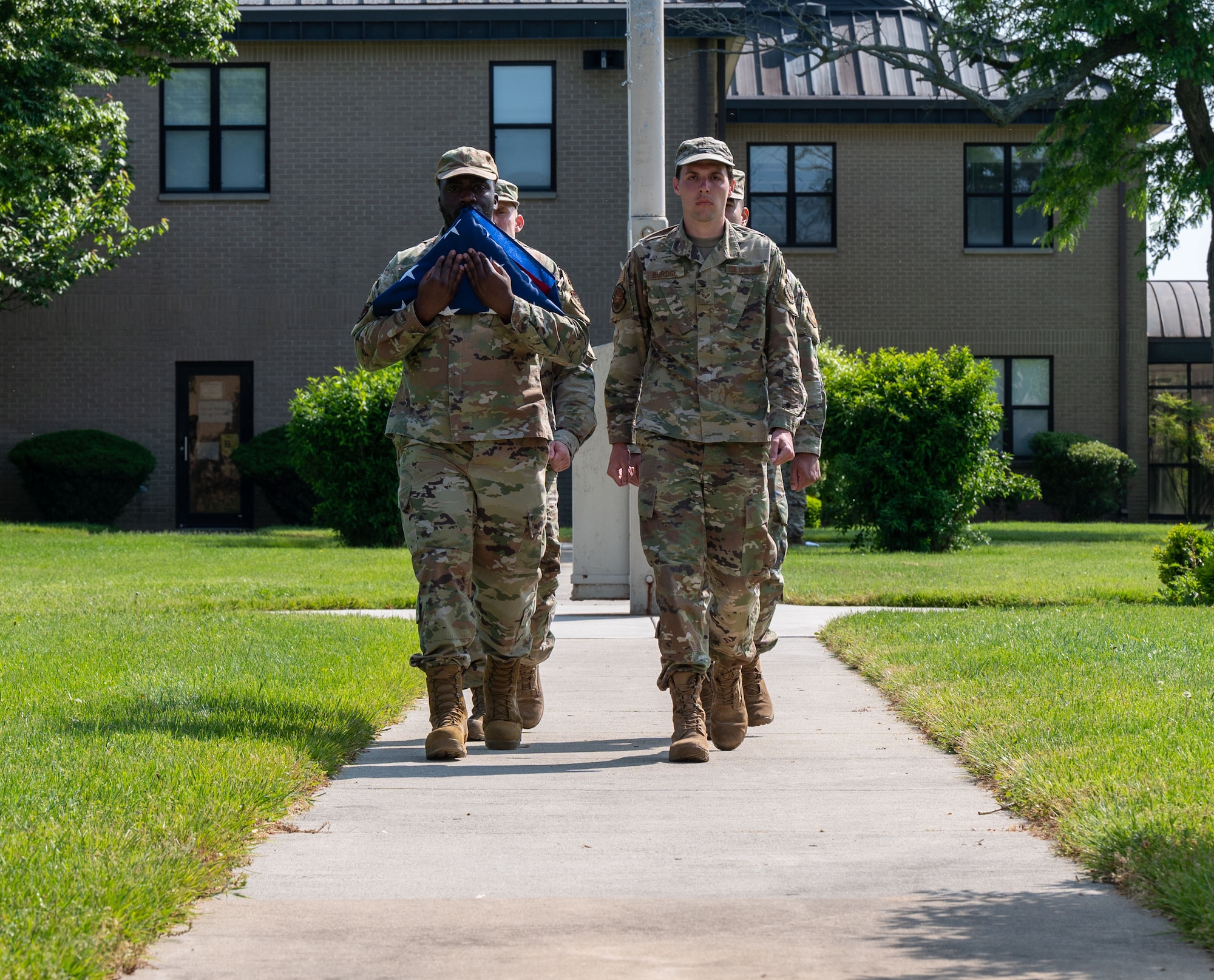 Airmen from Airman Leadership School Class 23-E retire the American flag during a retreat ceremony at Dover Air Force Base, Delaware, May 15, 2023. ALS Class 23-E and the 436th Mission Support Group hosted the retreat in honor of Peace Officer Memorial Day. (U.S. Air Force photo by Airman 1st Class Amanda Jett)