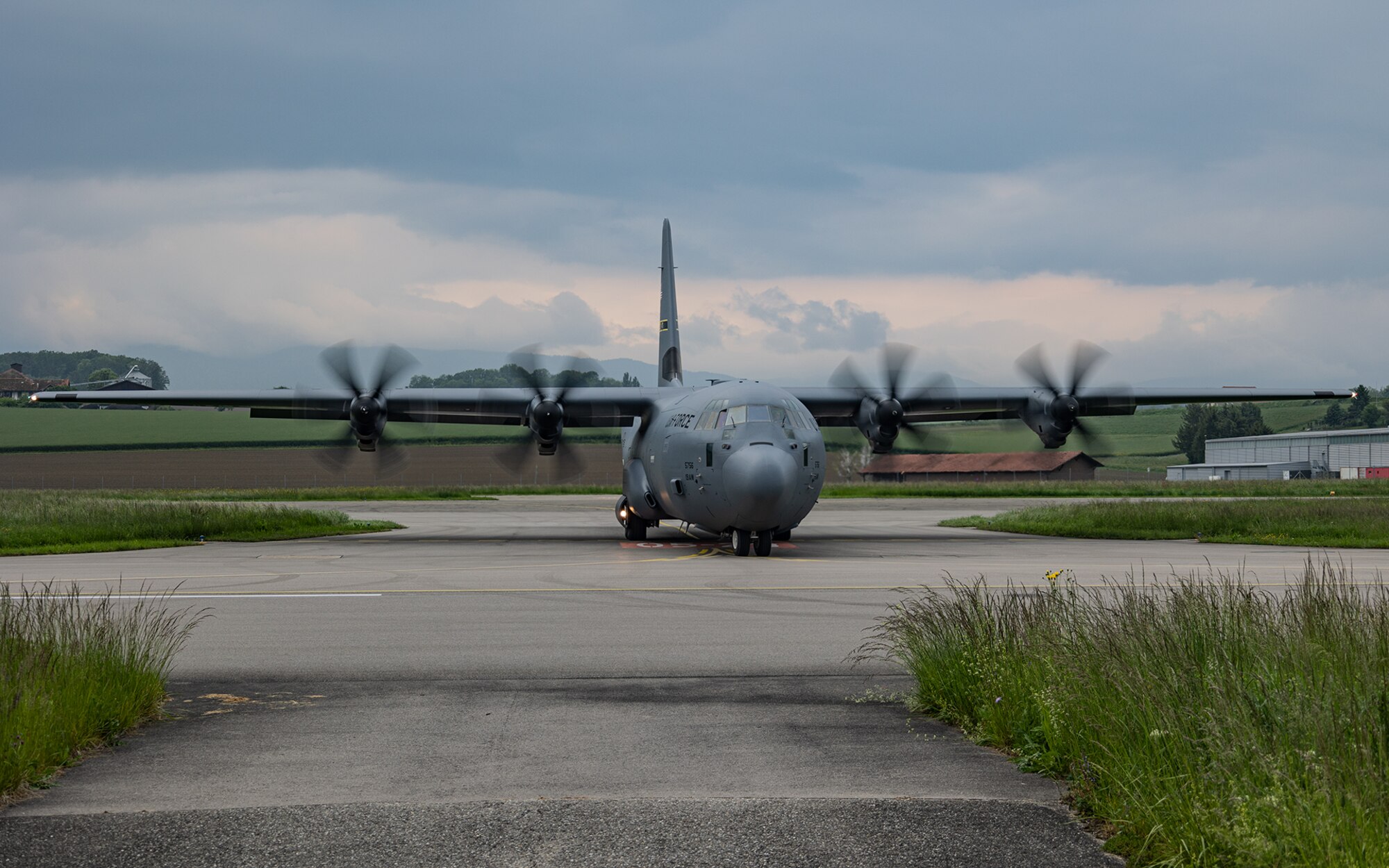 A C-130J delivers cargo on the flightline in Switzerland