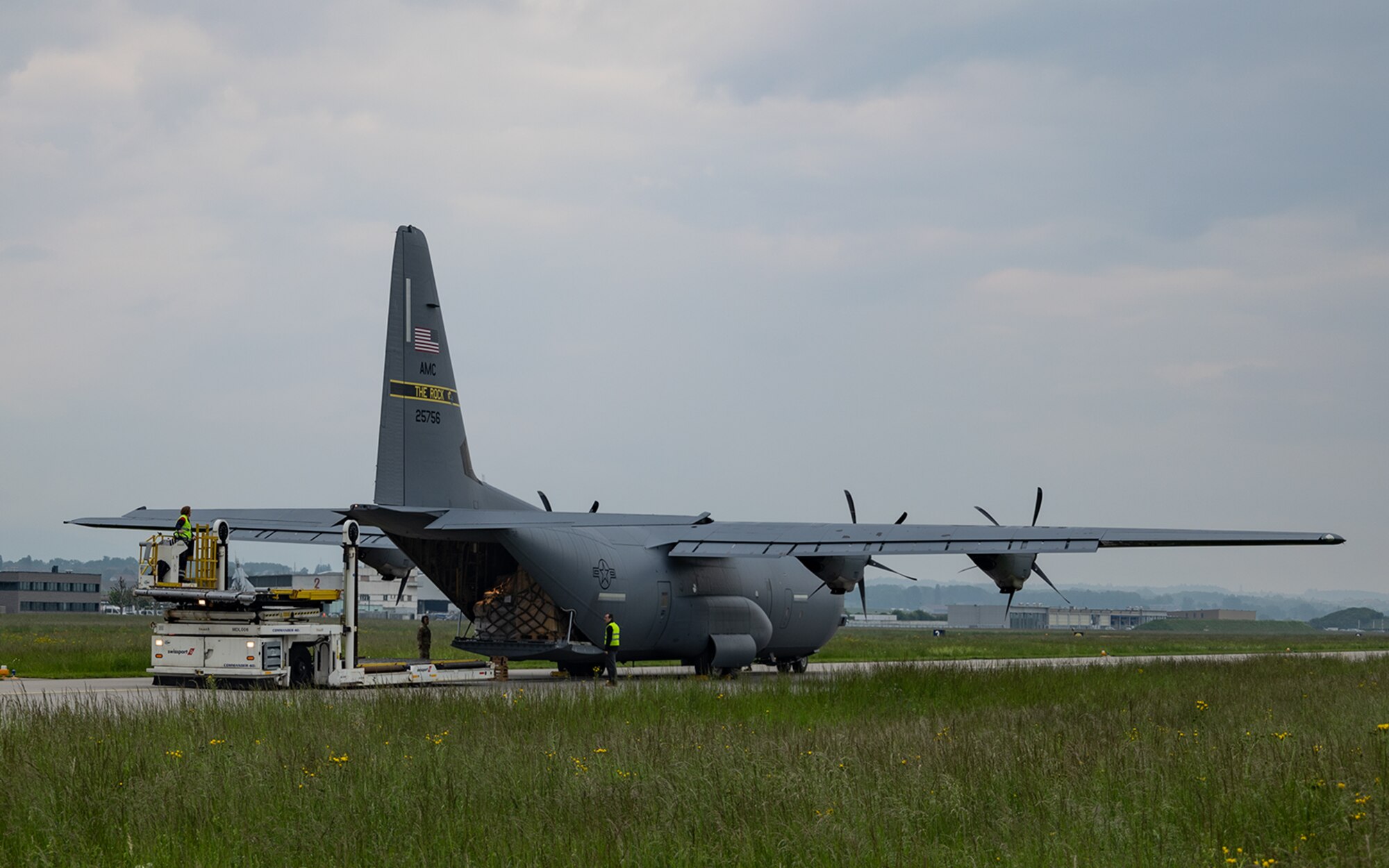 A C-130J delivers cargo on the flightline in Switzerland