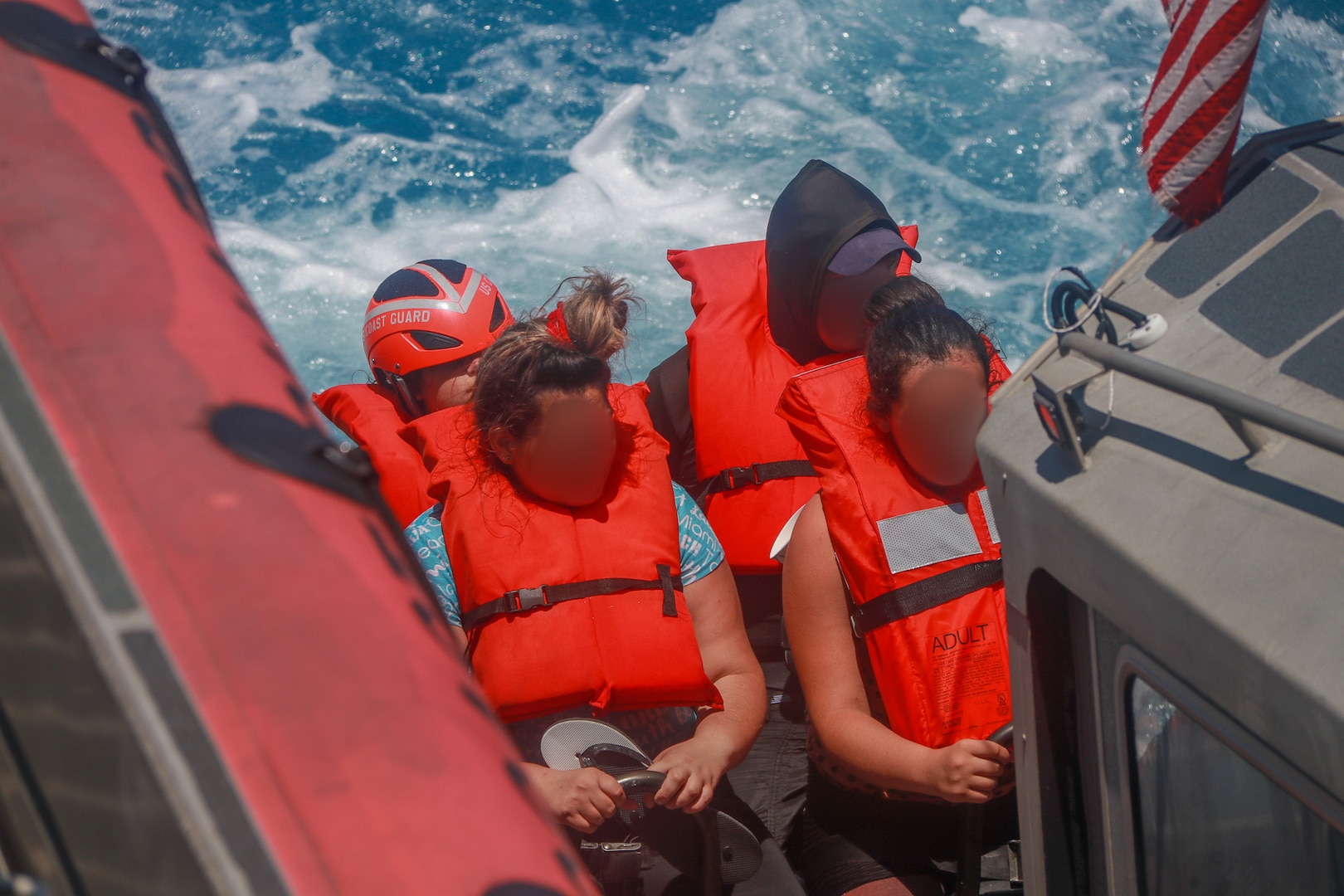 A Coast Guard Cutter Hamilton small boat boatcrew transports six migrants to Coast Guard Cutter Hamilton, May 9, 2023. The migrants were stranded on Cay Sal Island, Bahamas. (U.S. Coast Guard courtesy photo)