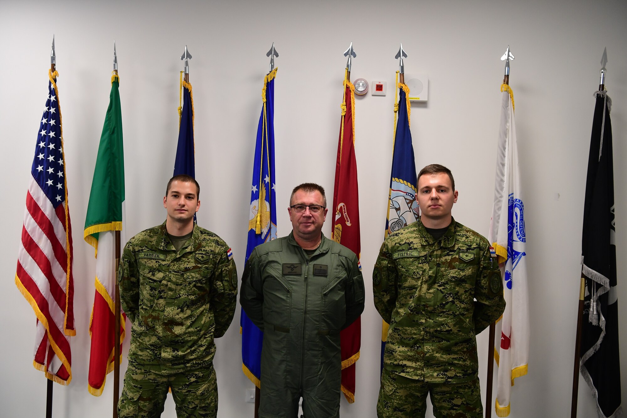 From left, Croatian Air Force Lance Cpl. Karlo Vargek, armament technician, Croatian Air Force Brig. Gen. Michael Križanec, Croatian Air Force commander, and Croatian Air Force Lance Cpl. Marko Fistric, aviation technician, pose for a photo at Airman Leadership School