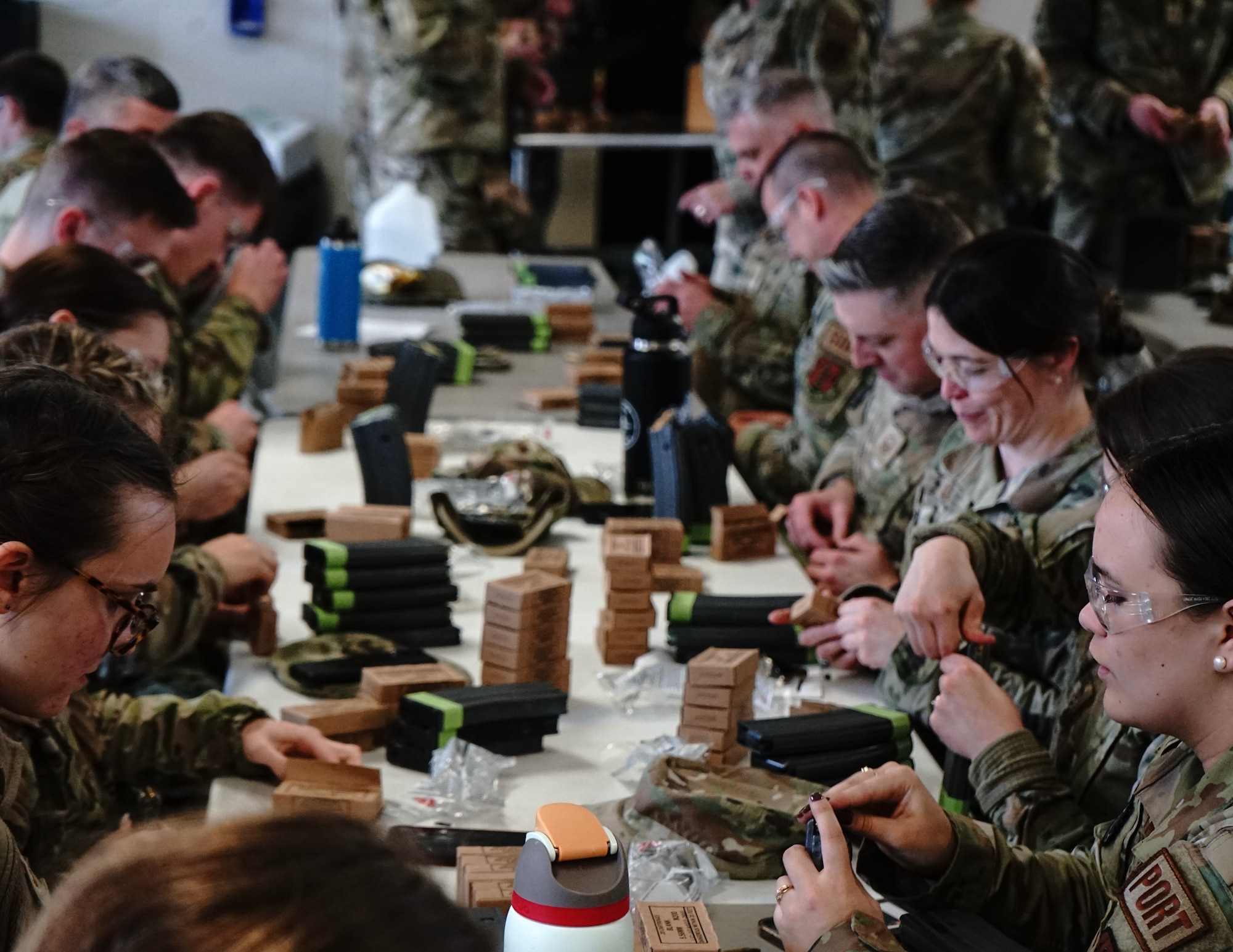 U.S. Air Force Airmen from the 133rd Logistics Readiness Squadron load magazines with 5.56 ammo at Camp Ripley, Little Falls, Minn., May 6, 2023.