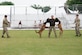 Staff Sgt. Daquan Roland-Hover, 316th Security Forces K-9 trainer, performs two-dog tactical maneuvers with two K-9s and their handlers at the National Mall in Washington D.C., May 13, 2023. This demonstration was a part of the three-day-long Vietnam Veterans' "Welcome Home" ceremony. (U.S. Air Force photo by Senior Airman Daekwon Stith)