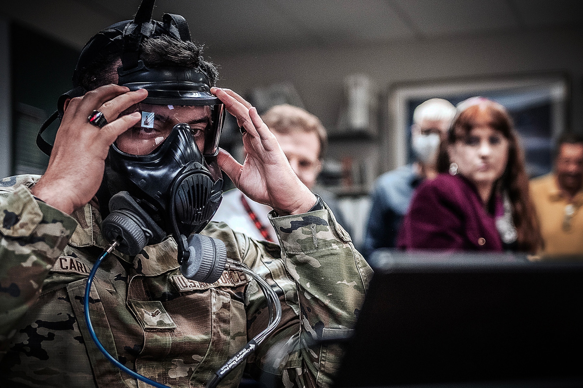 photo of an Airman testing a gas mask