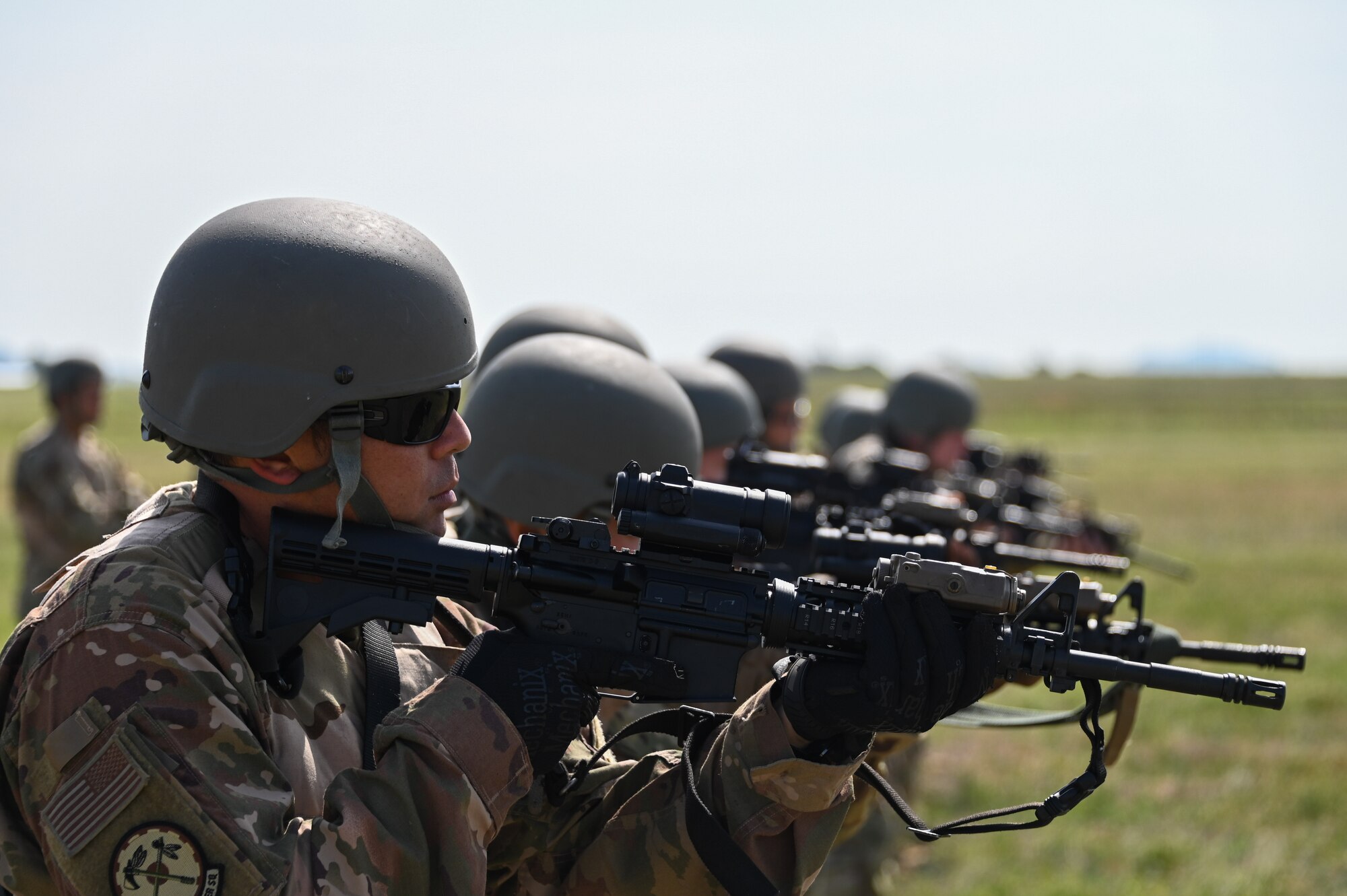 U.S. Air Force Tech. Sgt. Steven Durbin, 97th Civil Engineering Squadron section chief electrical systems, stands in a ready firing position during a deployment exercise at Altus Air Force Base, Oklahoma, May 10, 2023. More than 20 Airmen participated in combat arms training at a time, teaming up with others to simulate a deployed environment. (U.S. Air Force photo by Senior Airman Kayla Christenson)