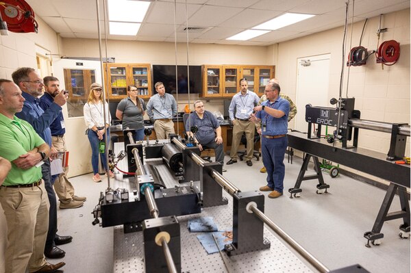 Dr. Robert Moser, ERDC's Senior Scientific Technical Manager, discusses advanced materials and experimental testing capabilities with USACE District personnel.
