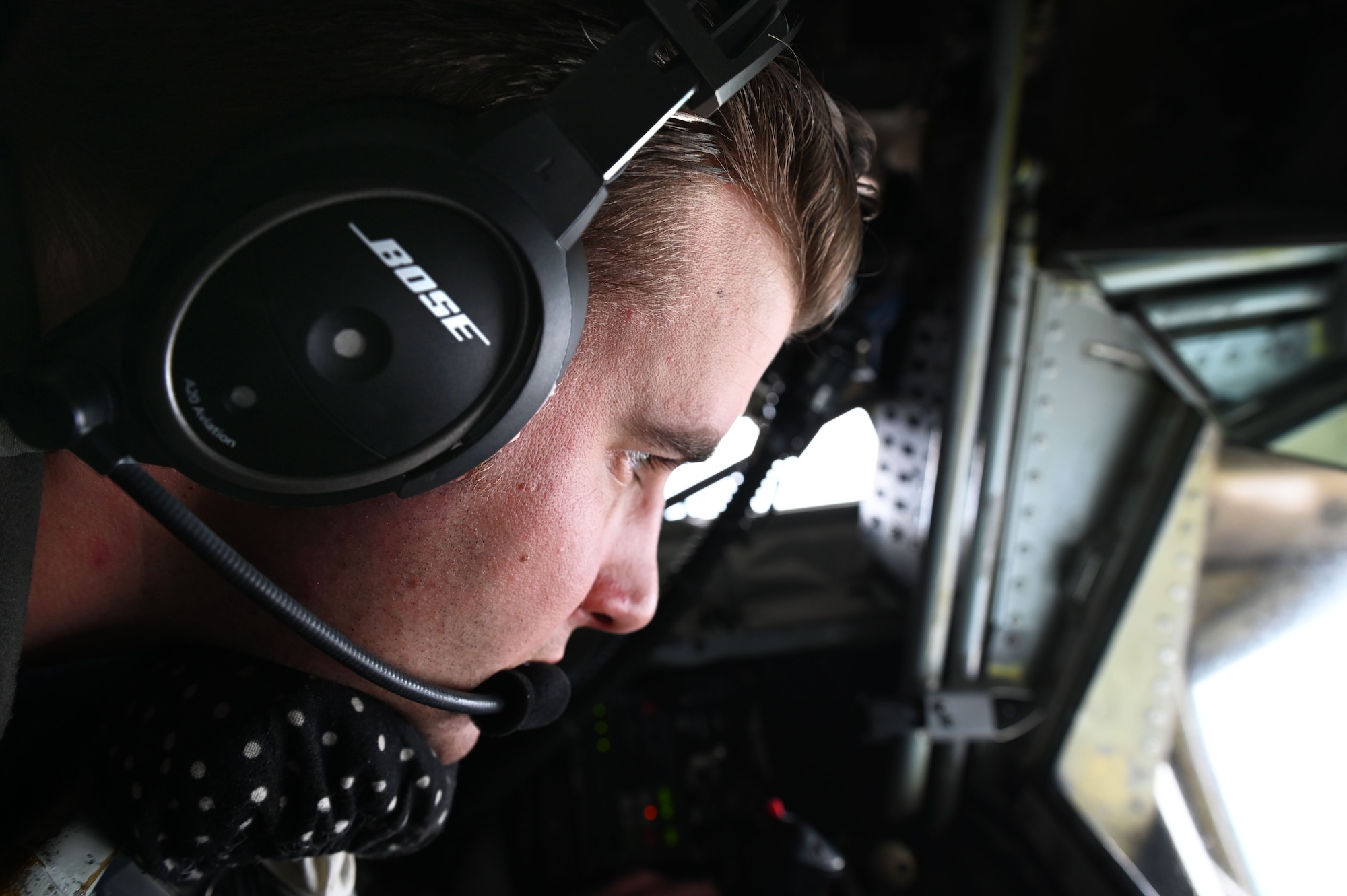 U.S. Air Force Senior Airman Josephus Straka, 509th Weapon Squadron Advanced Instructor Training student and inflight refueling specialist, prepares to refuel aircraft during a special operations force exercise, May 9, 2023. The training exposed students with the 509th WPS to the special operations mission set and aircraft, while also preparing its students for their large-scale Weapons School Integration capstone exercise where all weapons schools come together and perform peer-to-peer combat training. (U.S. Air Force photo by Staff Sgt. Lawrence Sena)