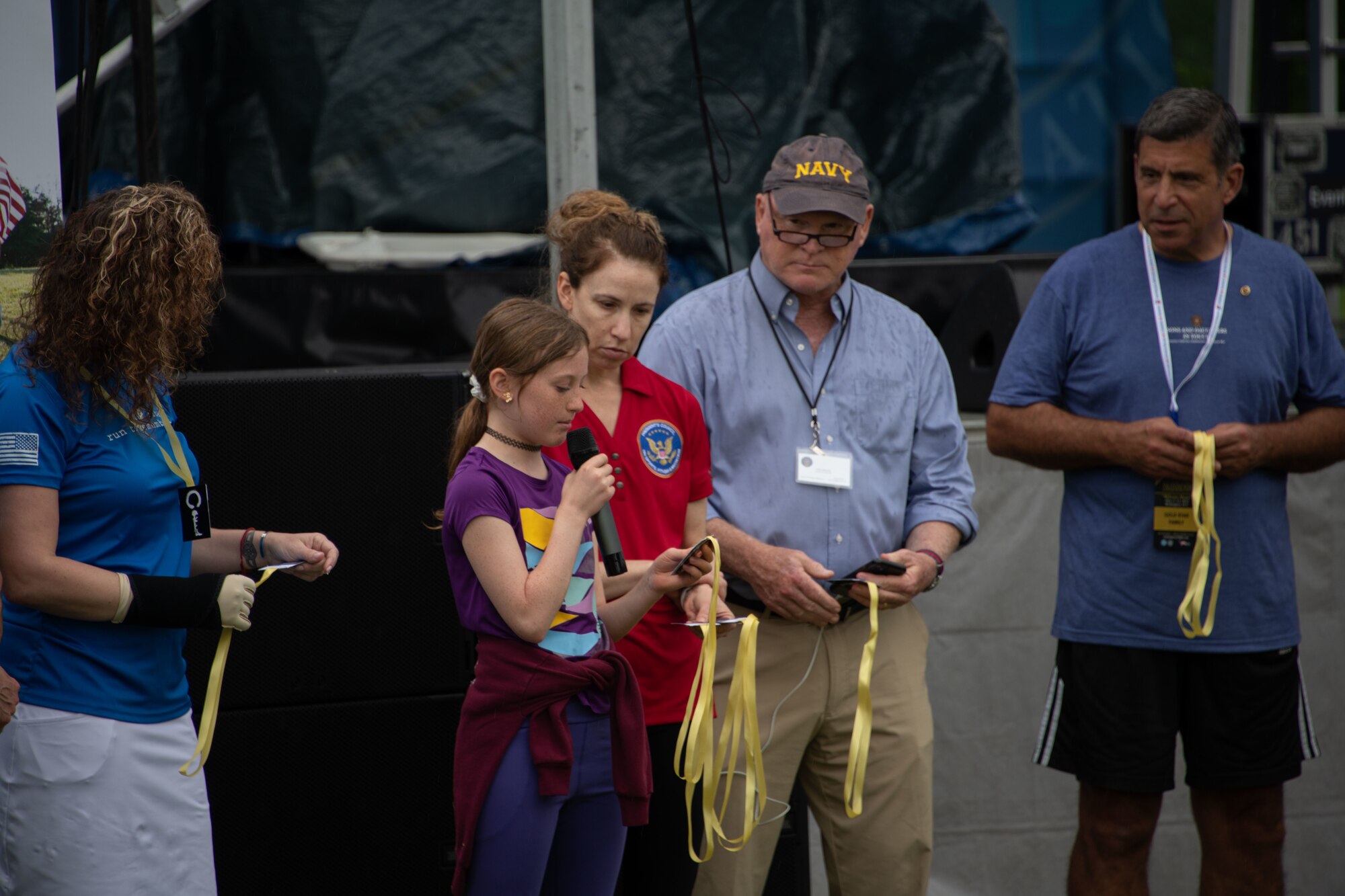 Madeline Fisher, a participant of the Vietnam Veterans' “Welcome Home” Ceremony, speaks the names of Vietnam War missing-in-action military members at the National Mall in Washington D.C., May 13, 2023. This was a part of the “rally points," where the names of more than 1,500 MIA members names were read out loud and recognized throughout the three day ceremony. (U.S. Air Force photo by Senior Airman Daekwon Stith)