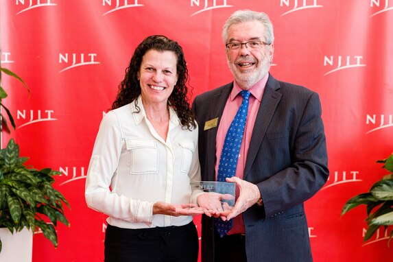 NAWCAD Lakehurst Workforce Operations Office Director Michele Huk (left) accepted the “Best Continuous Partner Award” from New Jersey Institute of Technology during a ceremony on May 5.