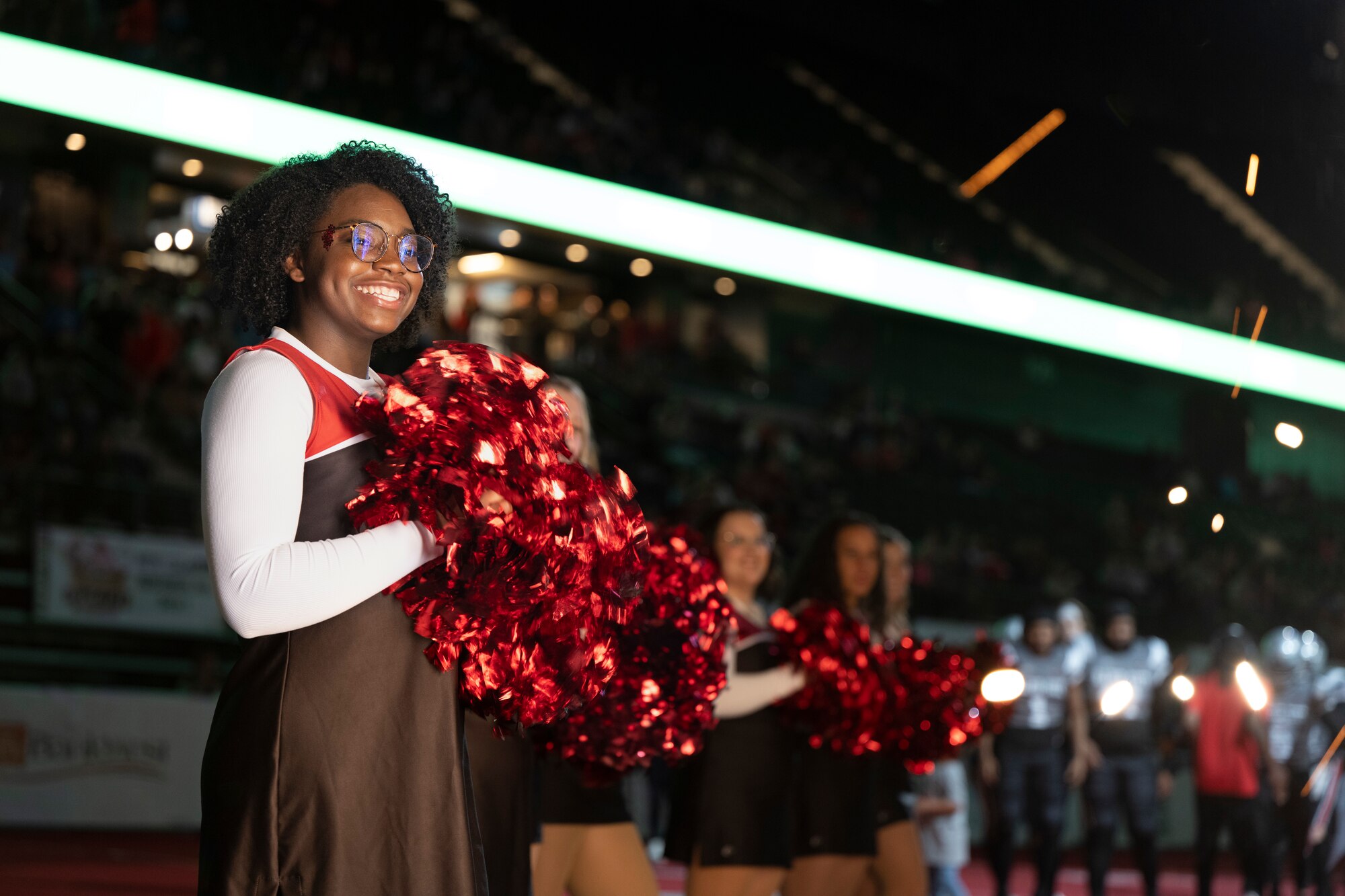 Senior Airman Miranda Simon, 28th Force Support Squadron force management technician, cheers during a Rapid City Marshals game at The Monument, an event center, in Rapid City, South Dakota, May 13, 2023.