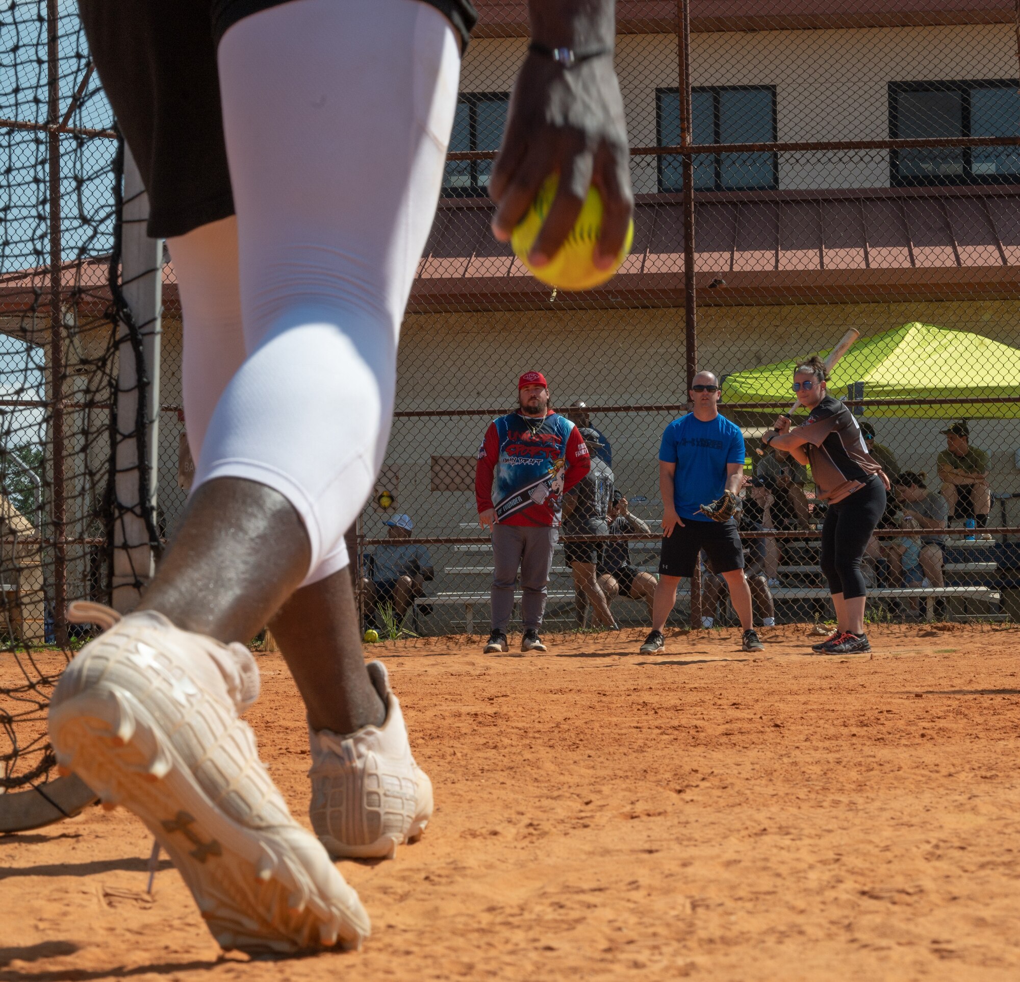 The pitcher of the Florida Highway Patrol softball team prepares to throw a pitch during the Police Week softball game at MacDill Air Force Base, Florida, May 17, 2023.