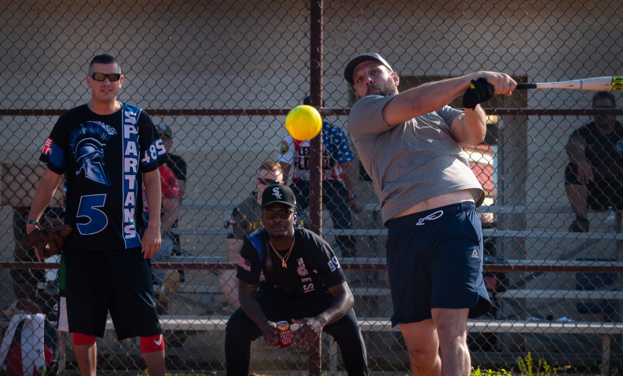 A player on the Tampa Police Department team hits a pitch during the Police Week Softball game at MacDill Air Force Base, Florida, May 17, 2023.