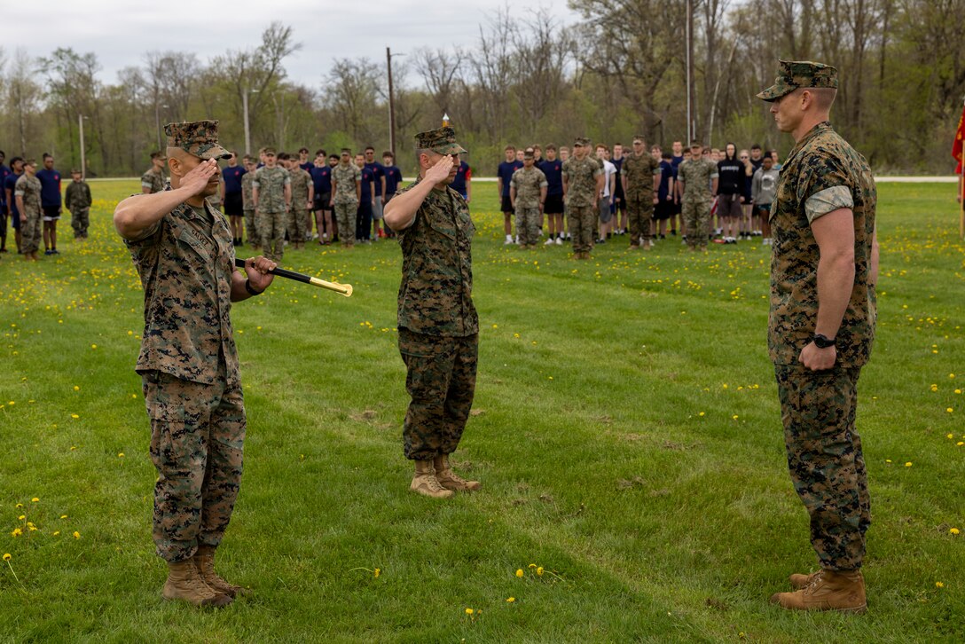U.S. Marine Corps SgtMaj. Luis A. Galvez, outgoing Sergeant Major, passes his duties as Sergeant Major of Recruiting Station Milwaukee, 9th Marine Corps District, to SgtMaj. Anthony E. Stockman, during a Post and Relief ceremony at Ft. McCoy, Wisconsin, May 13, 2023. The post and relief ceremony serves as the official changeover between Sergeants Major, honoring the outgoing SgtMaj's contributions to the unit while offering the opportunity for the oncoming SgtMaj to introduce himself to the Marines now under their charge. (U.S. Marine Corps photo by Sgt Ethan M. LeBlanc)