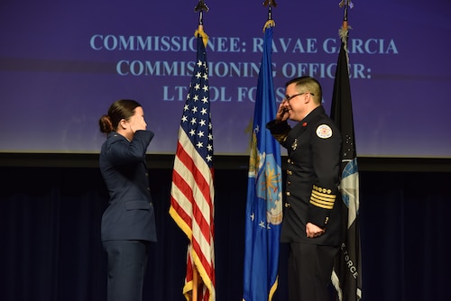U.S. Space Force 2nd Lt. Ravea Garcia, Angelo State University graduate, receives her first salute from her father at Angelo State University, San Angelo, Texas, May 12, 2023. The commissioning ceremony included the lieutenants receiving their first salute from an enlisted military member. (U.S. Air Force photo by Airman 1st Class Madison Collier)